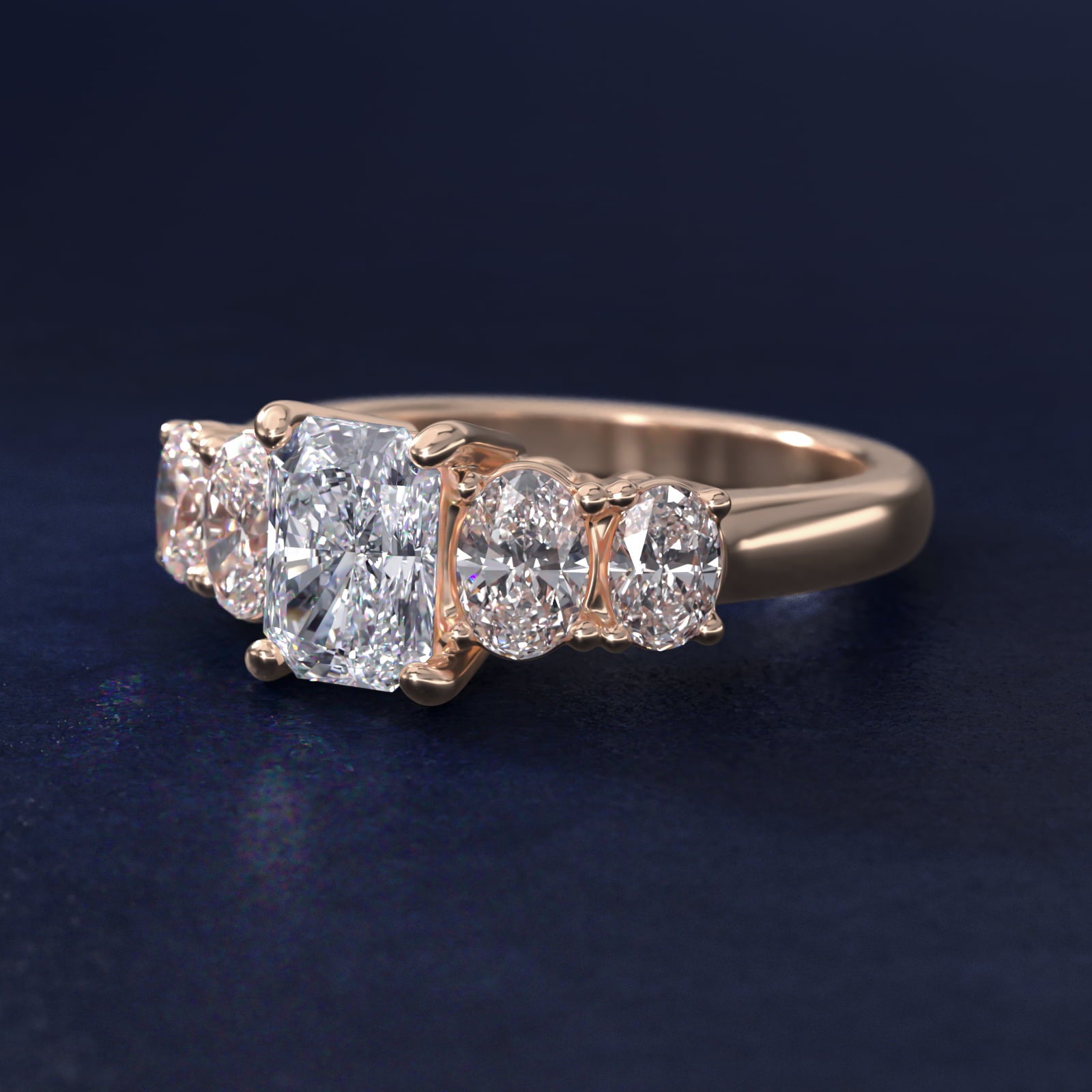 Graduated Oval Diamond Engagement Ring in 14k Rose Gold (1/2 ct. tw.) - Radiant Center