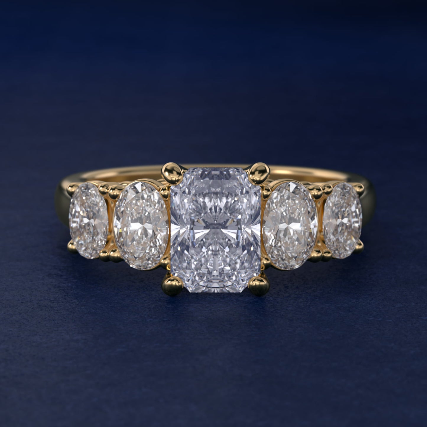 Graduated Oval Diamond Engagement Ring in 14K Yellow Gold (1/2 ct. tw.) - Radiant Center