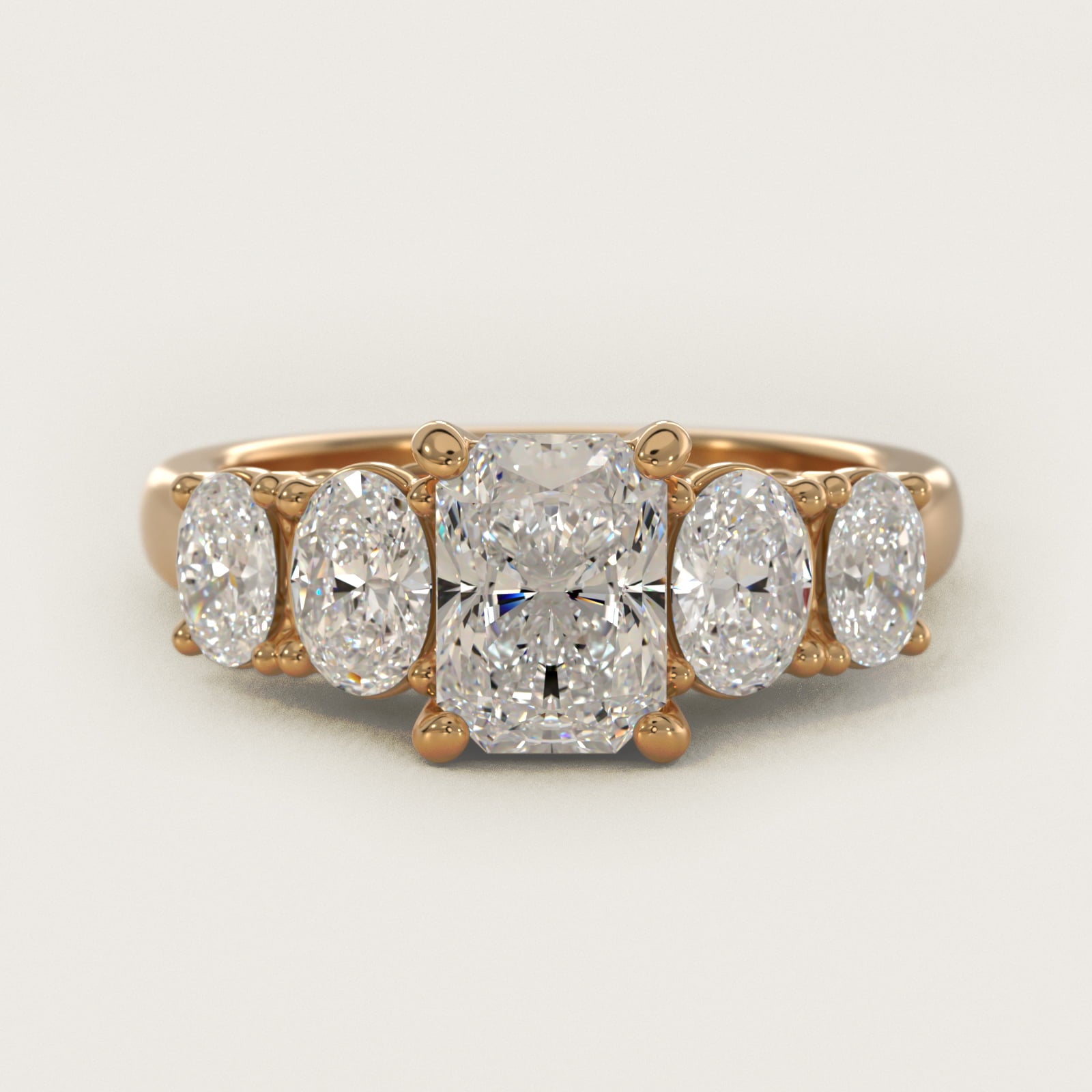 Graduated Oval Diamond Engagement Ring in 14K Yellow Gold (1/2 ct. tw.) - Radiant Center