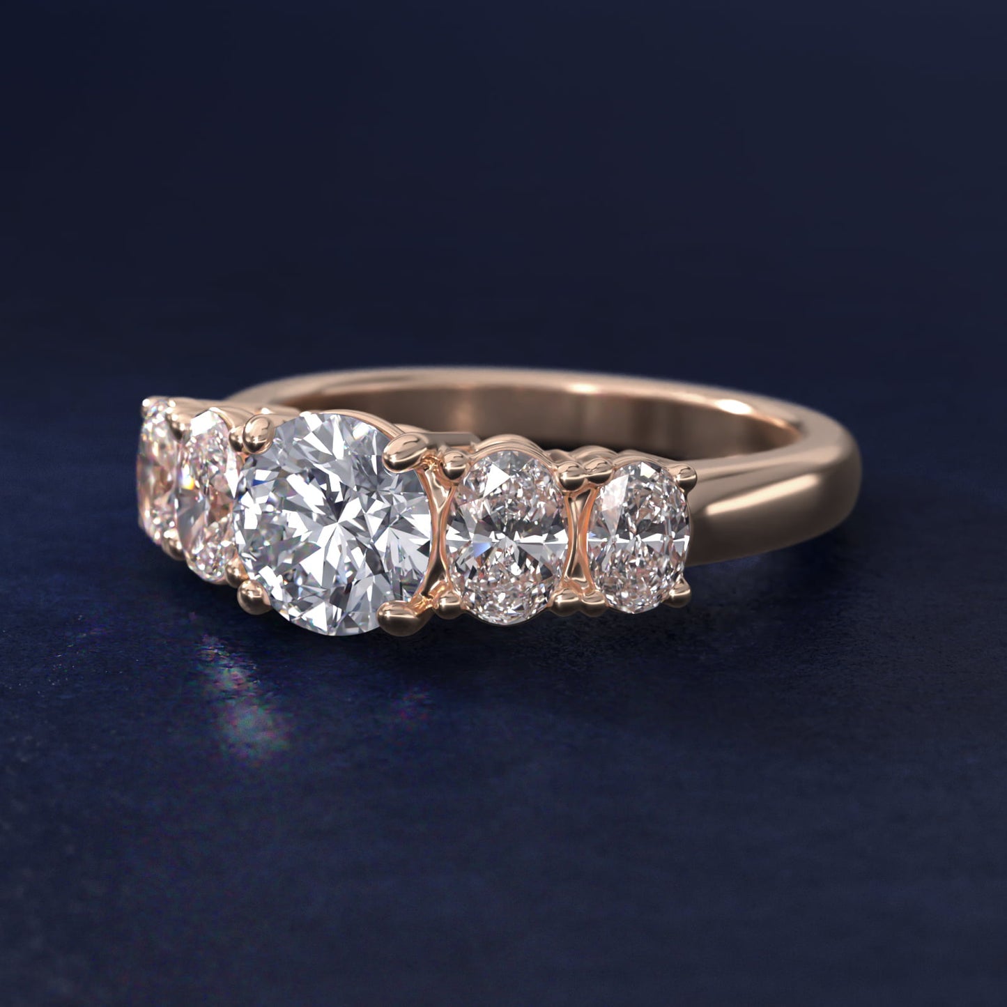 Graduated Oval Diamond Engagement Ring in 14k Rose Gold (1/2 ct. tw.) - Round Center
