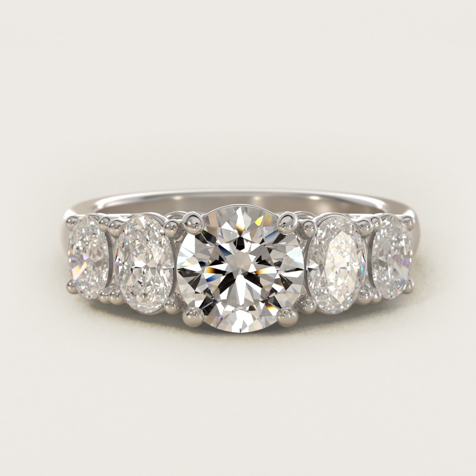 Graduated Oval Diamond Engagement Ring in 14k White Gold (1/2 ct. tw.) - Round Center