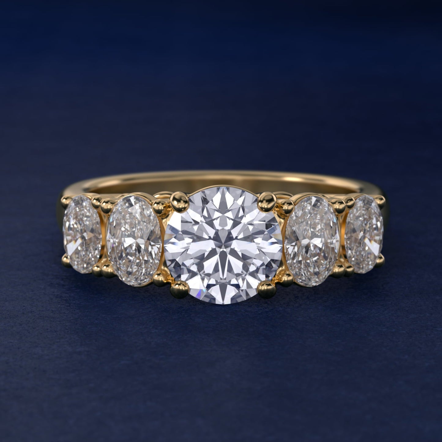 Graduated Oval Diamond Engagement Ring in 18k Yellow Gold (1/2 ct. tw.) - Round Center