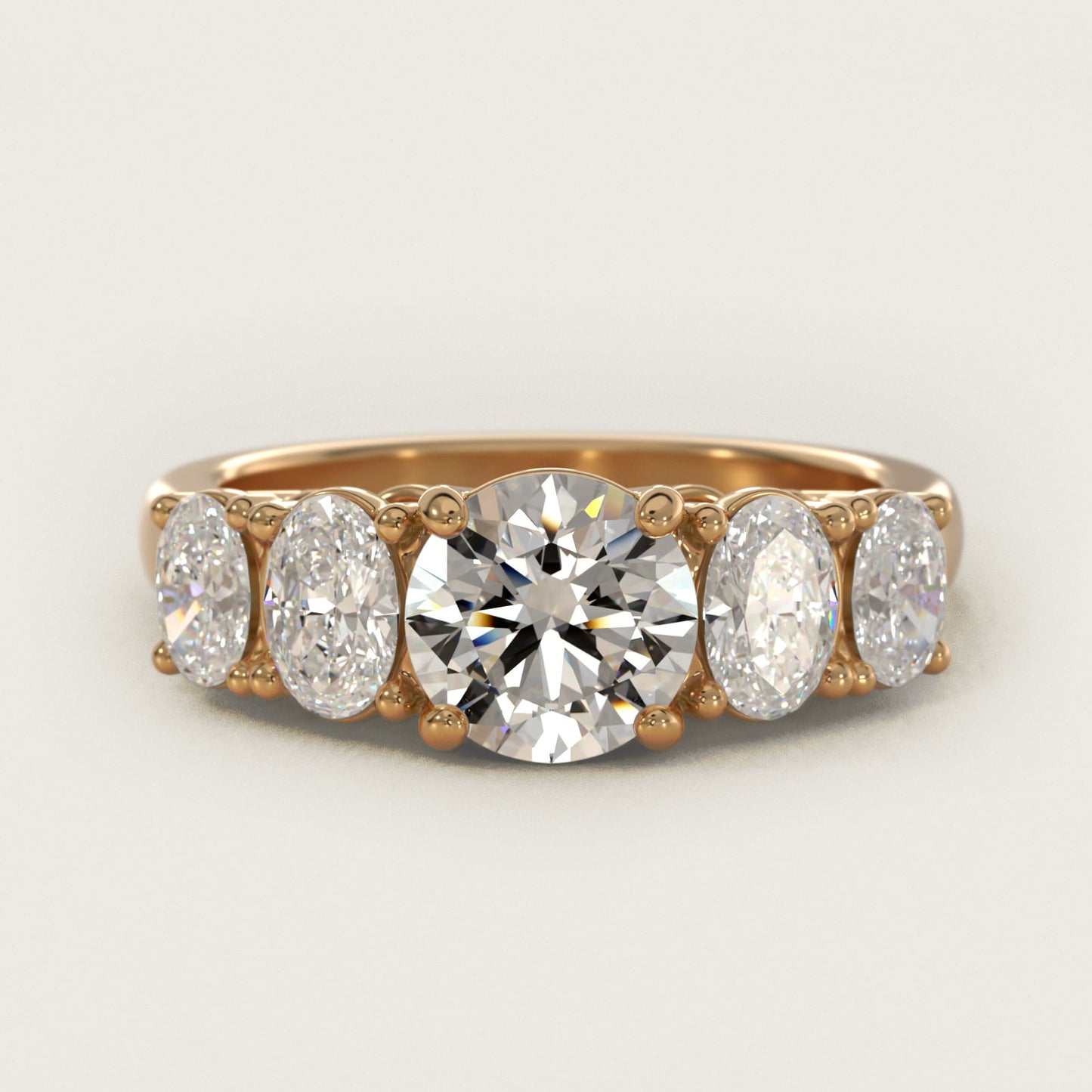 Graduated Oval Diamond Engagement Ring in 14K Yellow Gold (1/2 ct. tw.) - Round Center