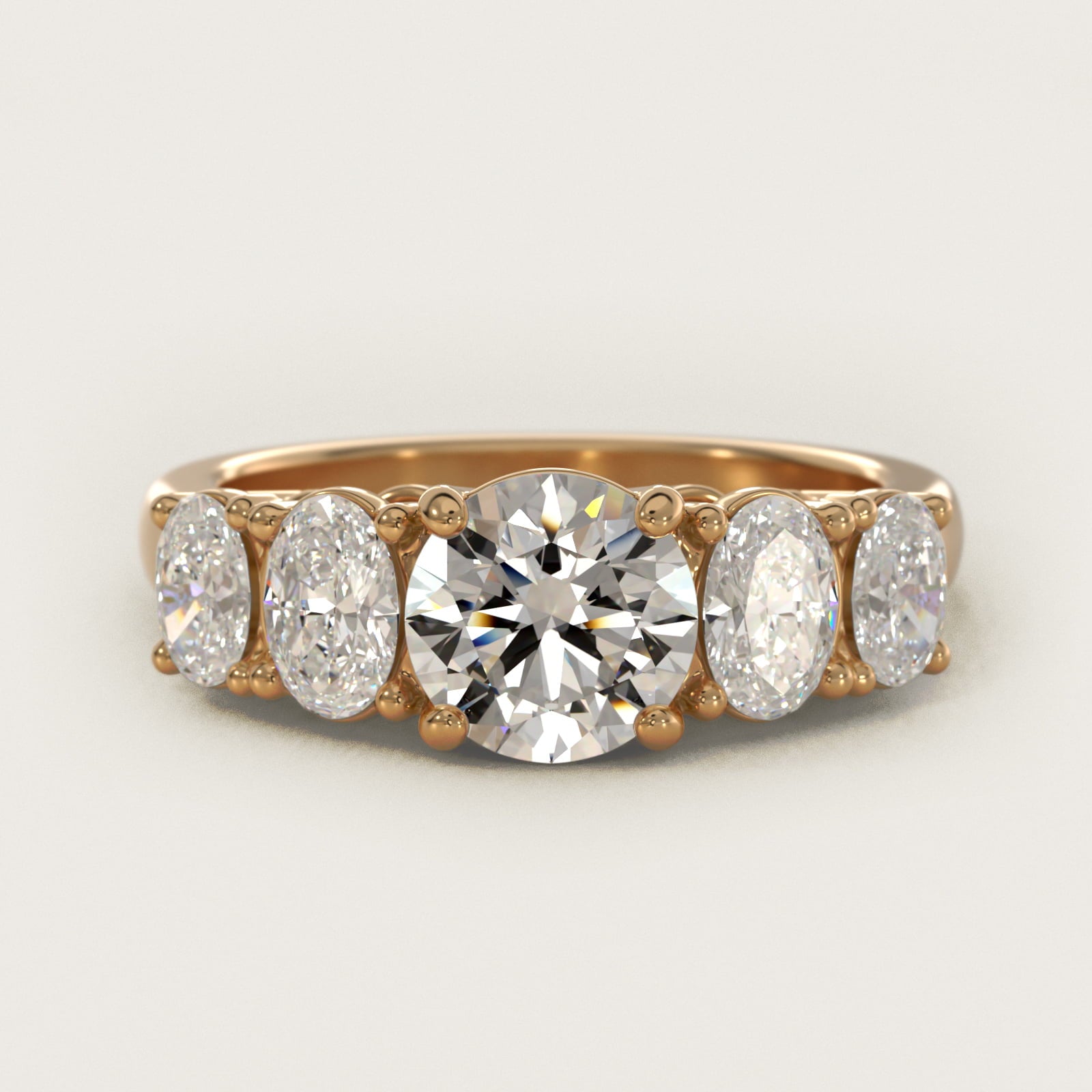 Graduated Oval Diamond Engagement Ring in 14K Yellow Gold (1/2 ct. tw.) - Round Center