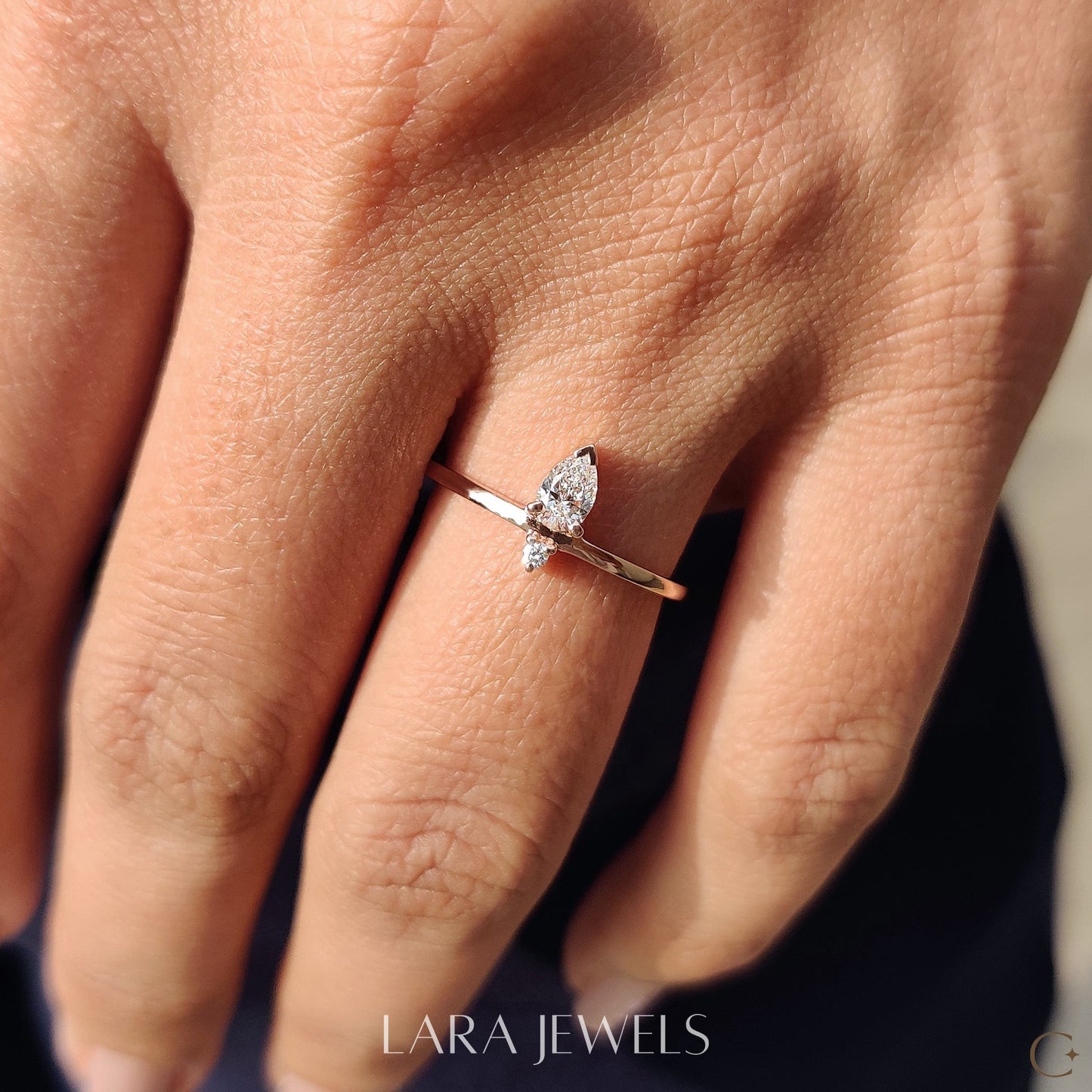 Lab grown round engagement ring in Pear and Round Diamond, available in Silver. IGI certified, ethically sourced, handcrafted at Lara Jewels.
