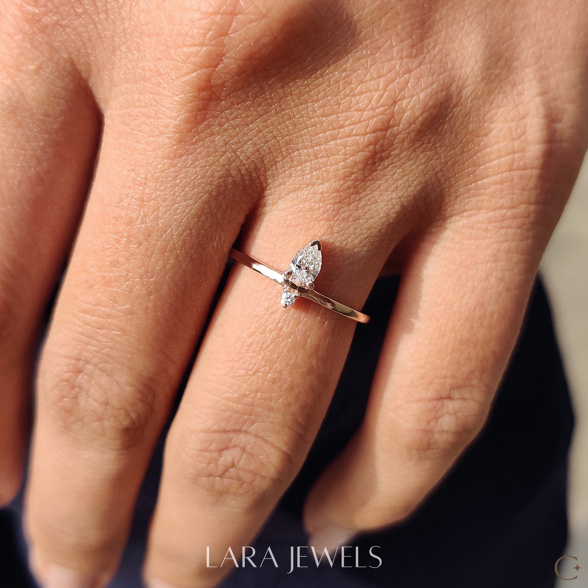 Lab grown round engagement ring in Pear and Round Diamond, available in Silver. IGI certified, ethically sourced, handcrafted at Lara Jewels.