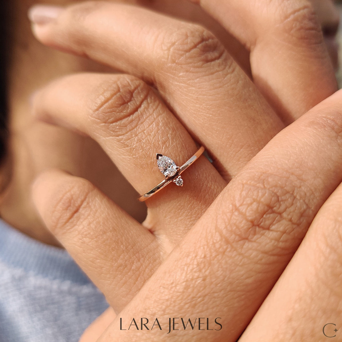Lab grown round engagement ring in Pear and Round Diamond, available in Silver. IGI certified, ethically sourced, handcrafted at Lara Jewels.