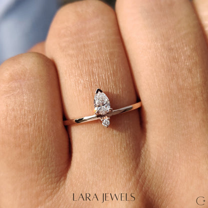 Lab grown round engagement ring in Pear and Round Diamond, available in Silver. IGI certified, ethically sourced, handcrafted at Lara Jewels.