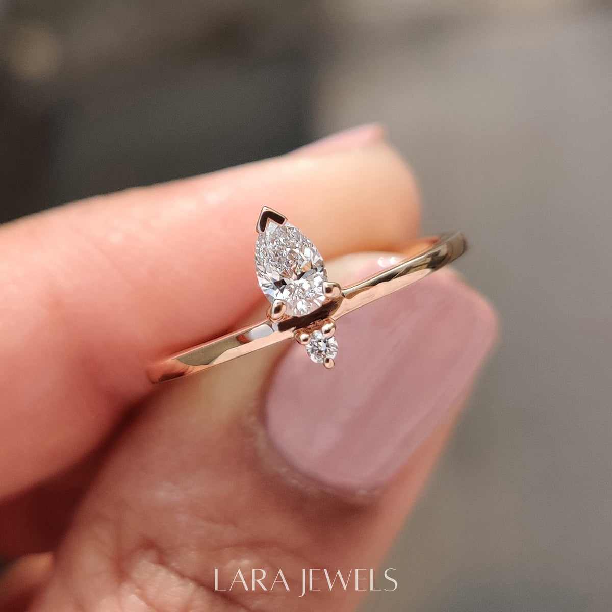 Lab grown round engagement ring in Pear and Round Diamond, available in Silver. IGI certified, ethically sourced, handcrafted at Lara Jewels.