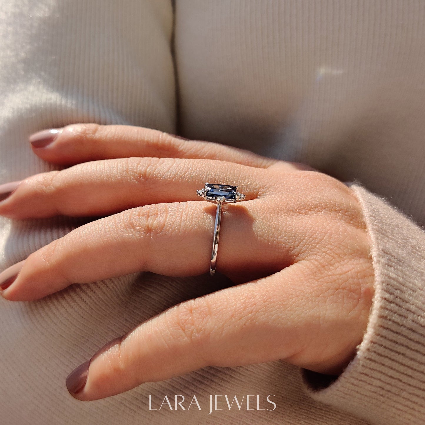 Lab grown emerald engagement ring in Lara Jewels setting, available in Silver. IGI certified, ethically sourced, handcrafted at Lara Jewels.