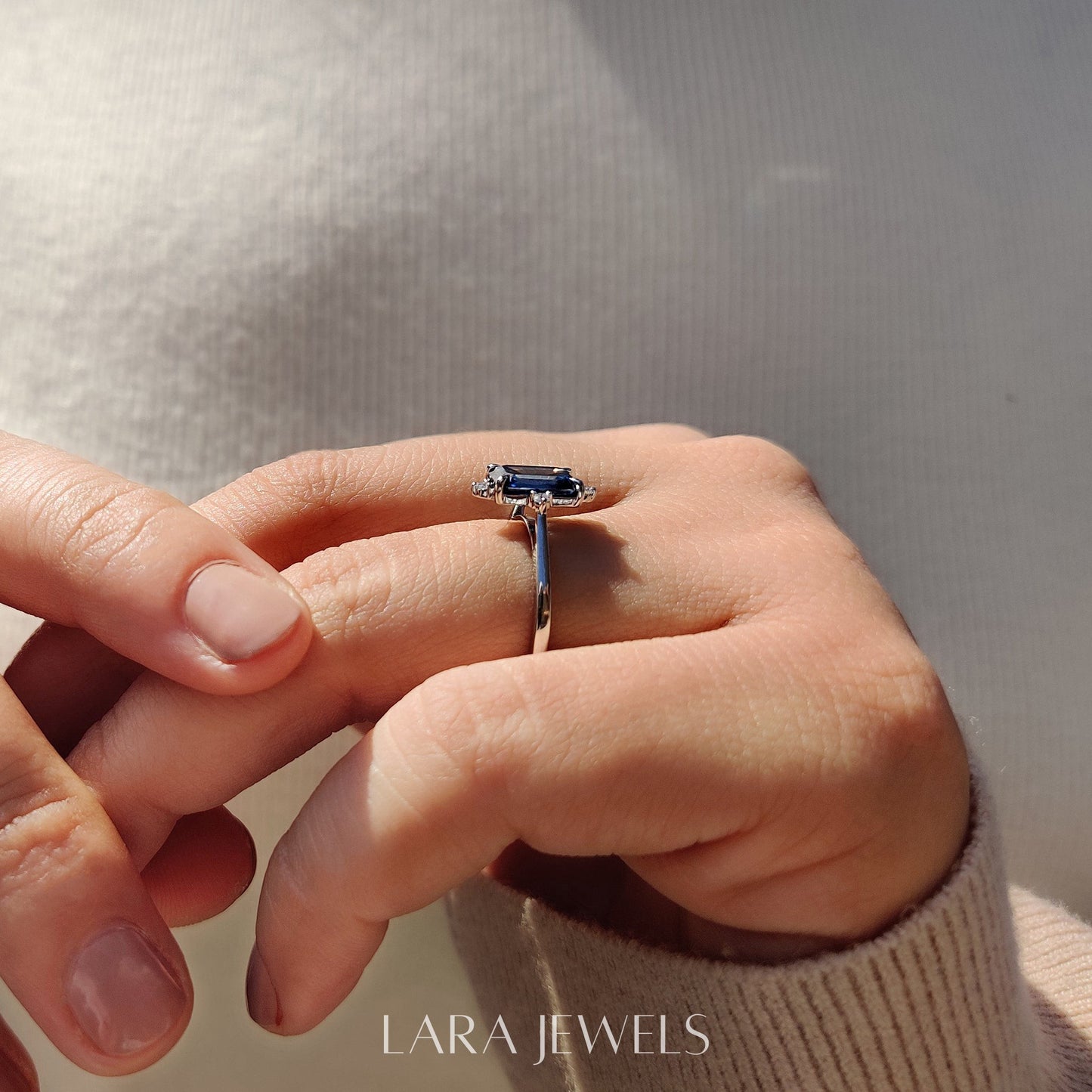 Lab grown emerald engagement ring in Lara Jewels setting, available in Silver. IGI certified, ethically sourced, handcrafted at Lara Jewels.