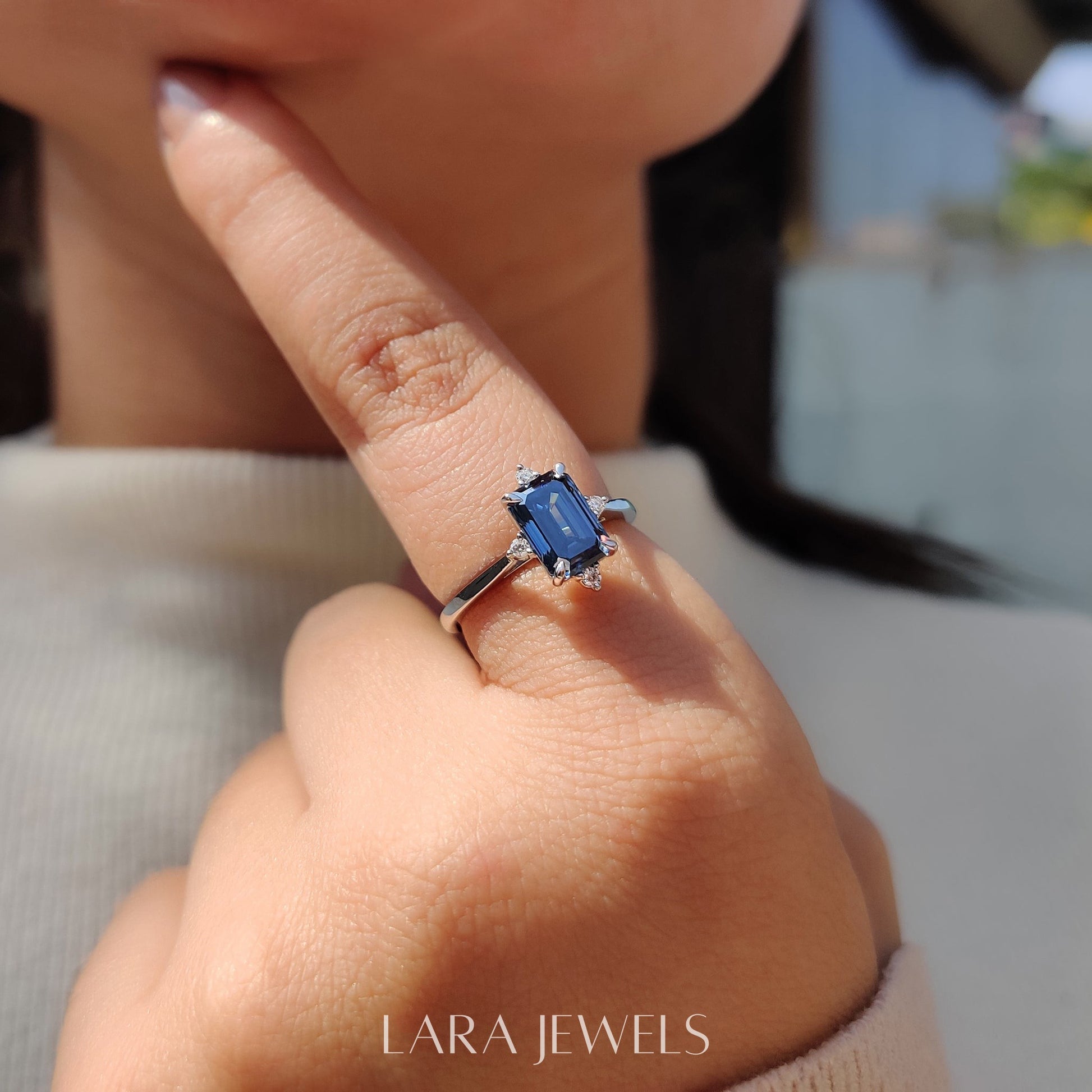 Lab grown emerald engagement ring in Lara Jewels setting, available in Silver. IGI certified, ethically sourced, handcrafted at Lara Jewels.