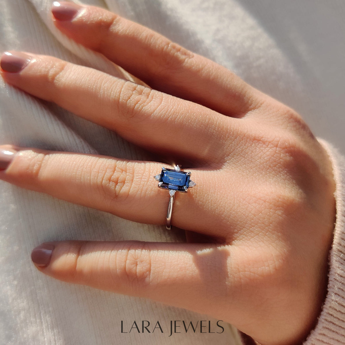 Lab grown emerald engagement ring in Lara Jewels setting, available in Silver. IGI certified, ethically sourced, handcrafted at Lara Jewels.