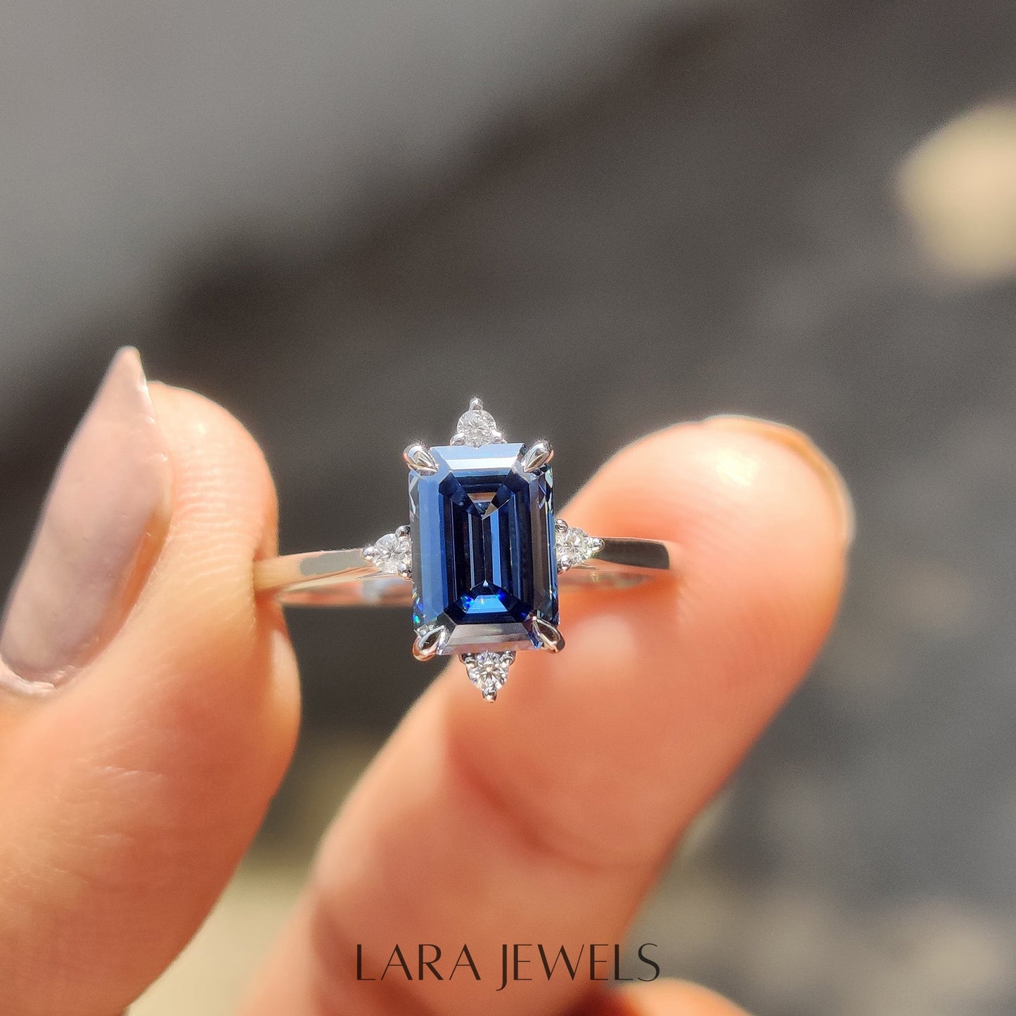 Lab grown emerald engagement ring in Lara Jewels setting, available in Silver. IGI certified, ethically sourced, handcrafted at Lara Jewels.