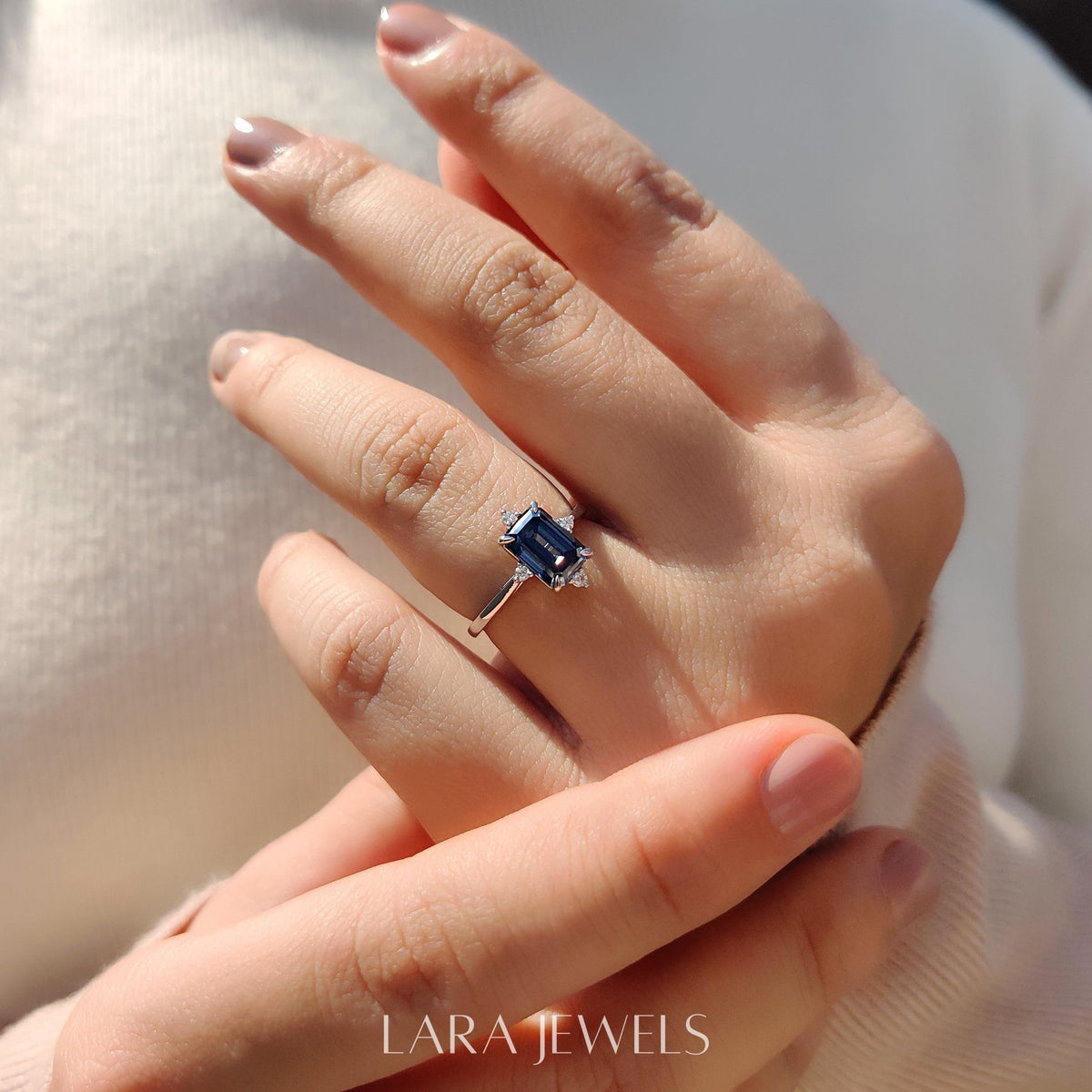 Lab grown emerald engagement ring in Lara Jewels setting, available in Silver. IGI certified, ethically sourced, handcrafted at Lara Jewels.