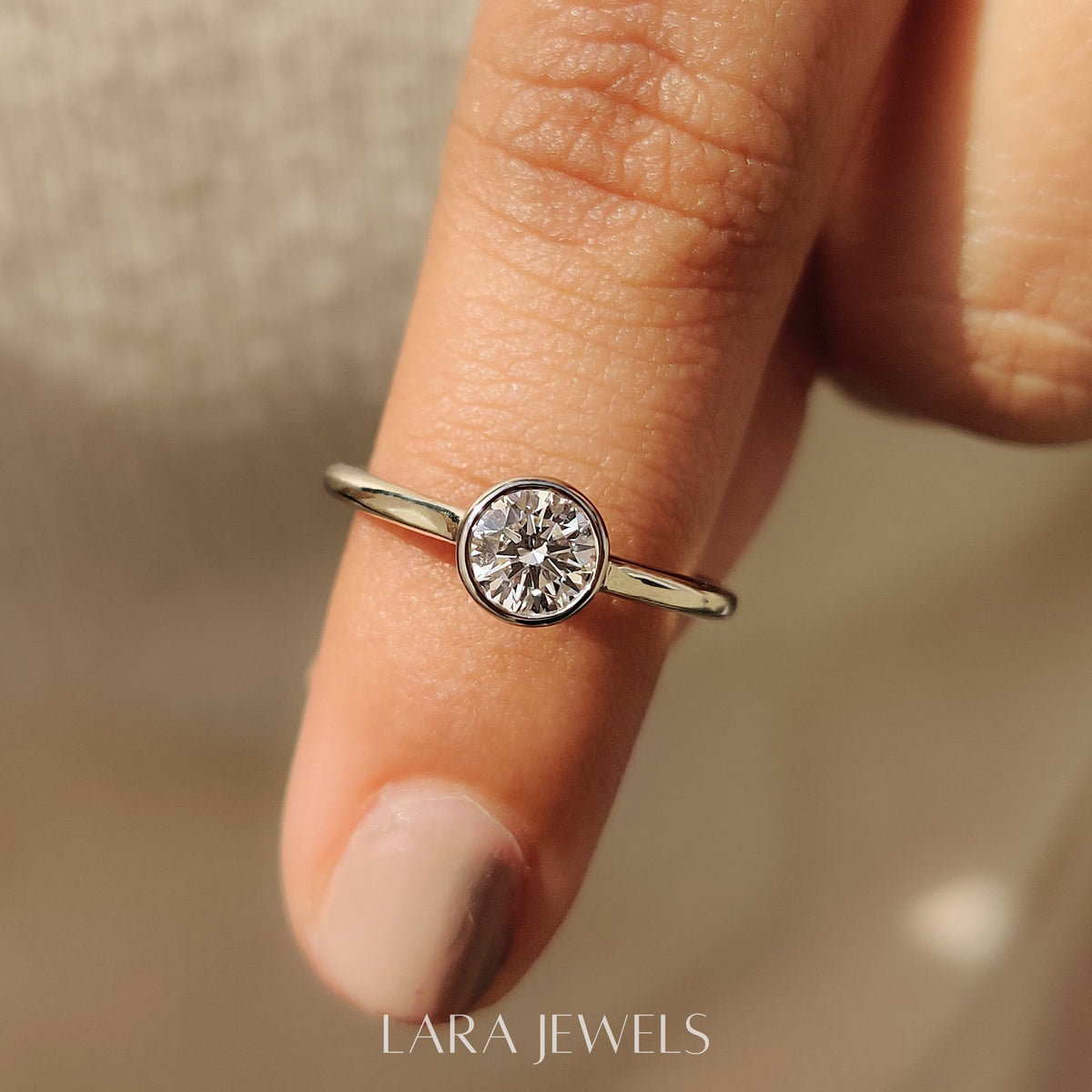 Lab grown round engagement ring in White Gold, available in Silver. IGI certified, ethically sourced, handcrafted at Lara Jewels.