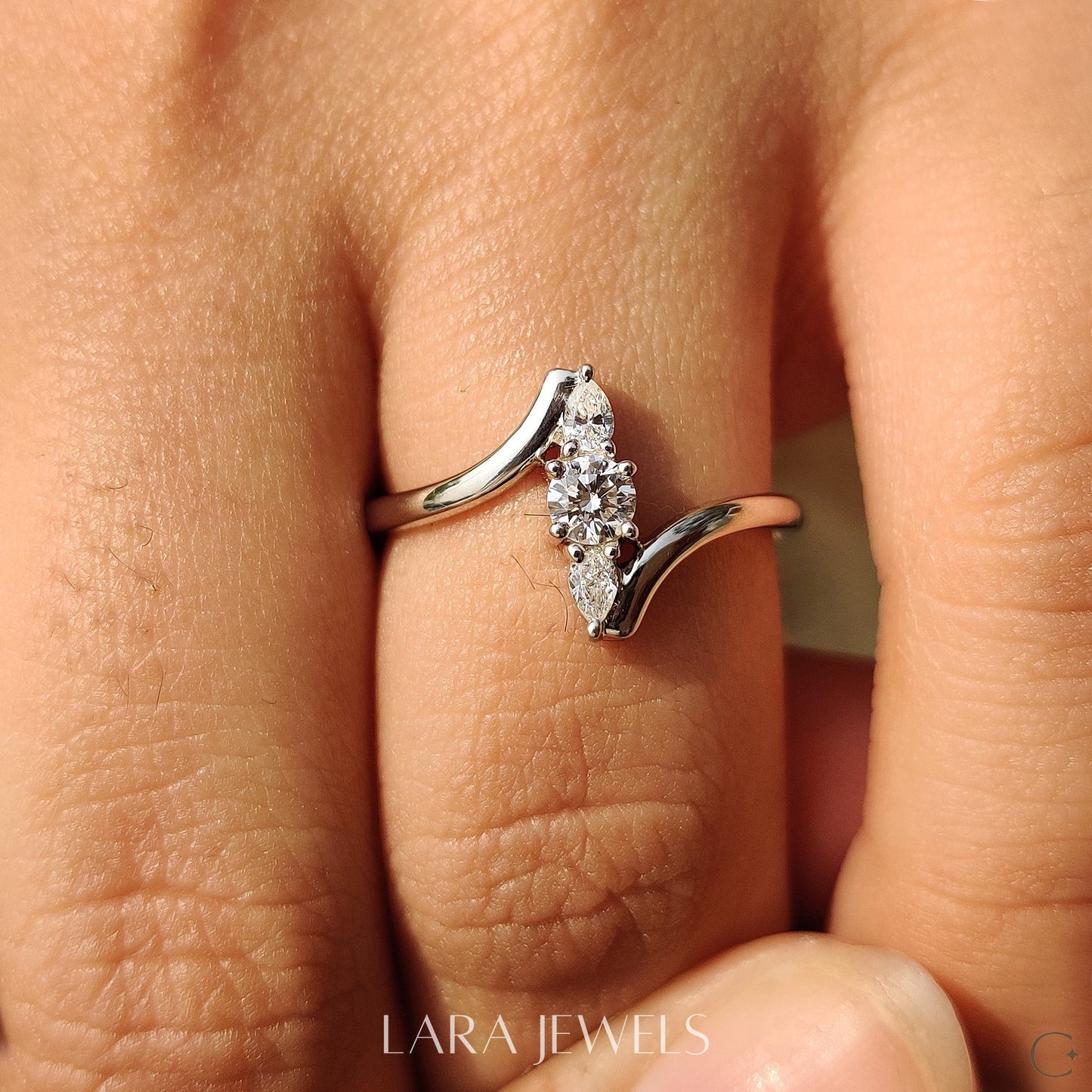 Lab grown round engagement ring in Round And Pear Diamond, available in Silver. IGI certified, ethically sourced, handcrafted at Lara Jewels.