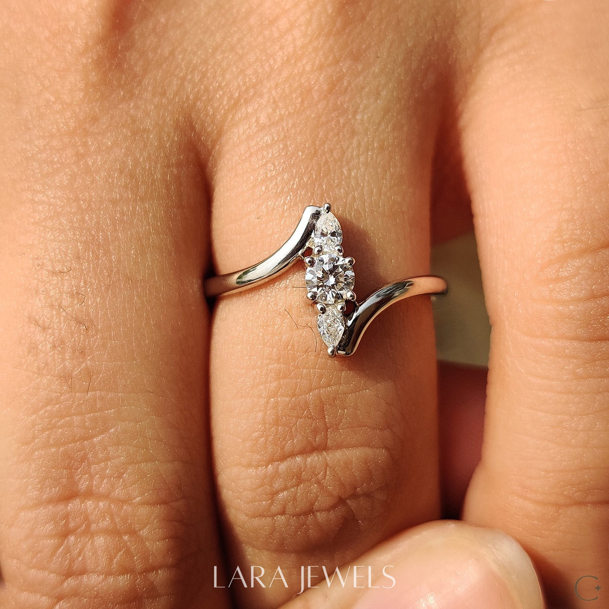 Lab grown round engagement ring in Round And Pear Diamond, available in Silver. IGI certified, ethically sourced, handcrafted at Lara Jewels.