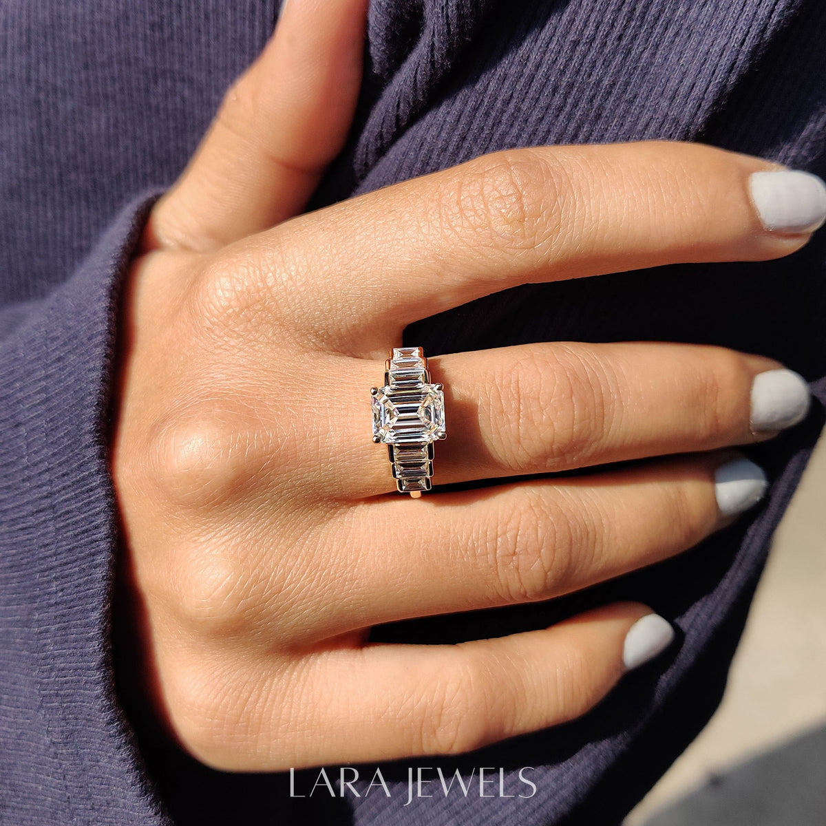 Lab grown emerald engagement ring in Lara Jewels setting, available in Silver. IGI certified, ethically sourced, handcrafted at Lara Jewels.