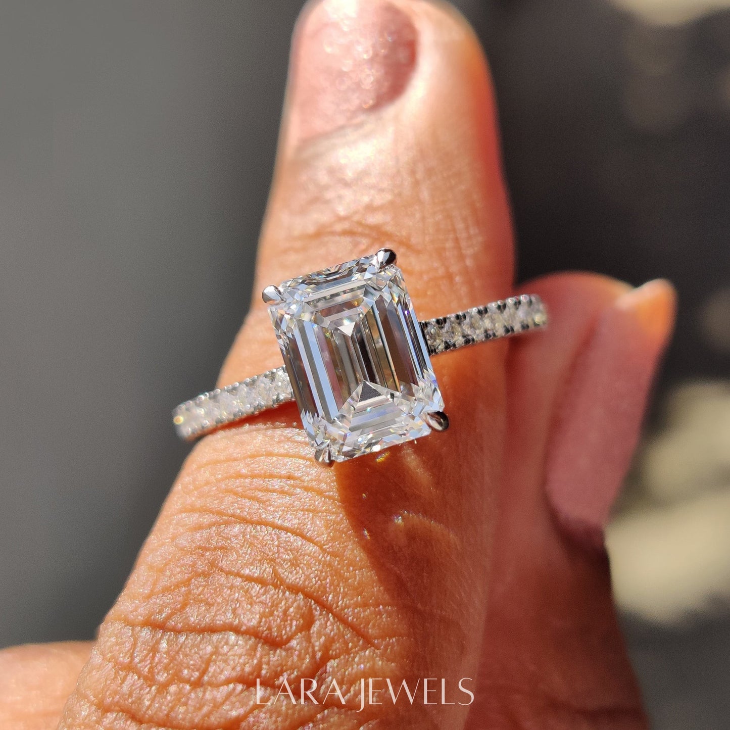 Lab grown emerald engagement ring in Lara Jewels setting, available in Silver. IGI certified, ethically sourced, handcrafted at Lara Jewels.