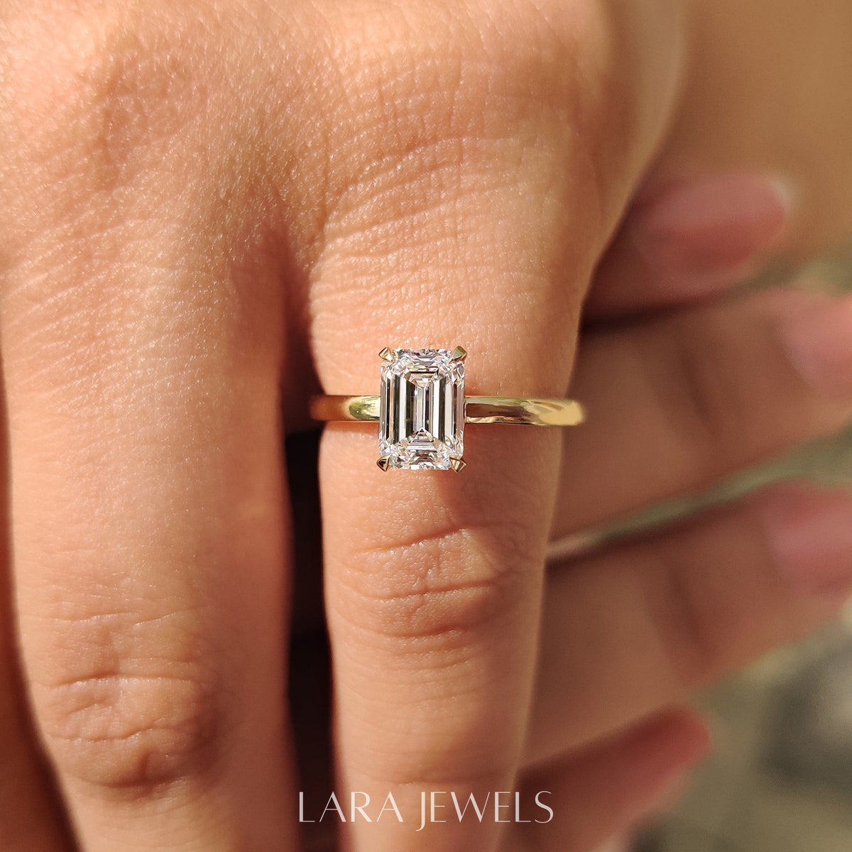 Lab grown emerald engagement ring in Lara Jewels setting, available in Silver. IGI certified, ethically sourced, handcrafted at Lara Jewels.