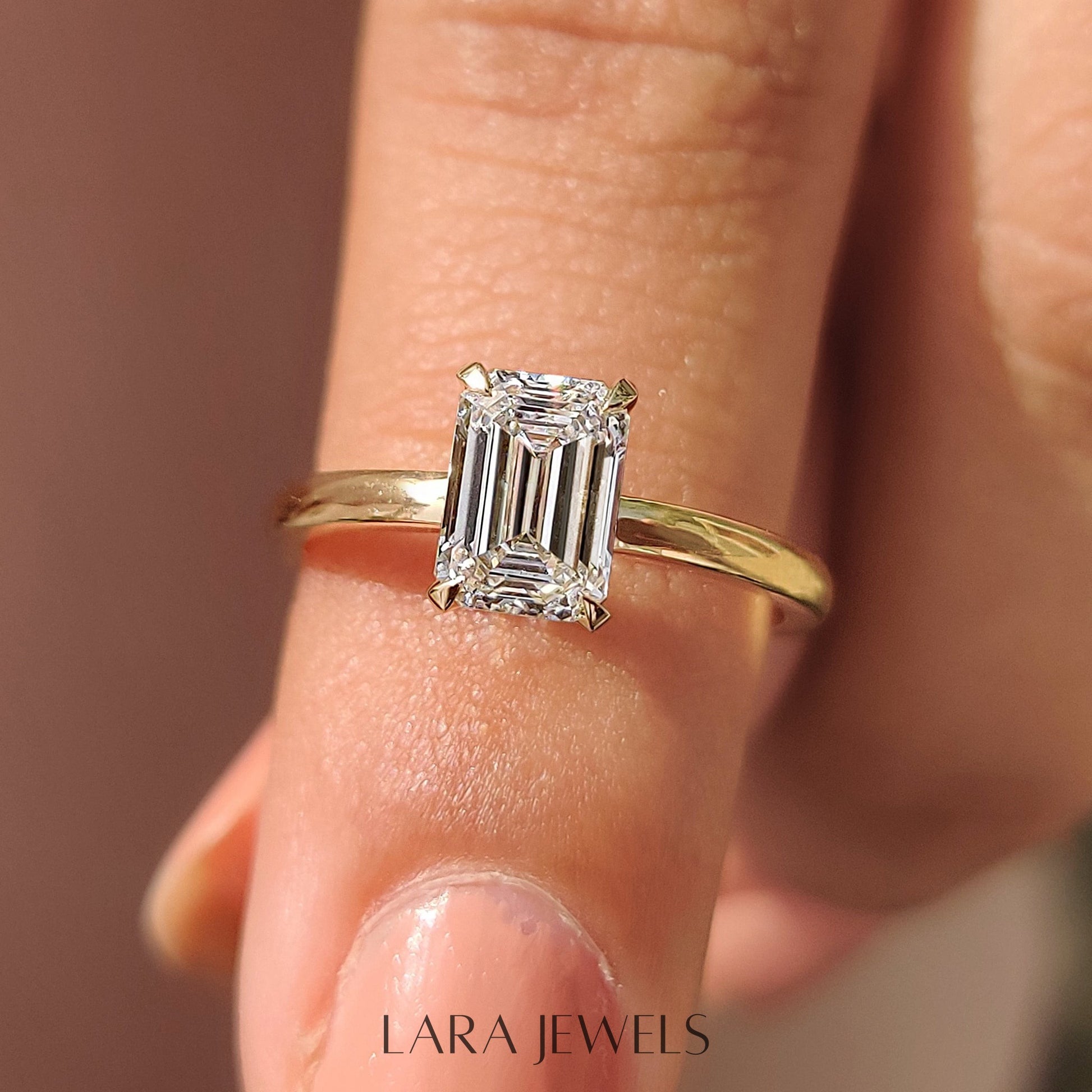 Lab grown emerald engagement ring in Lara Jewels setting, available in Silver. IGI certified, ethically sourced, handcrafted at Lara Jewels.