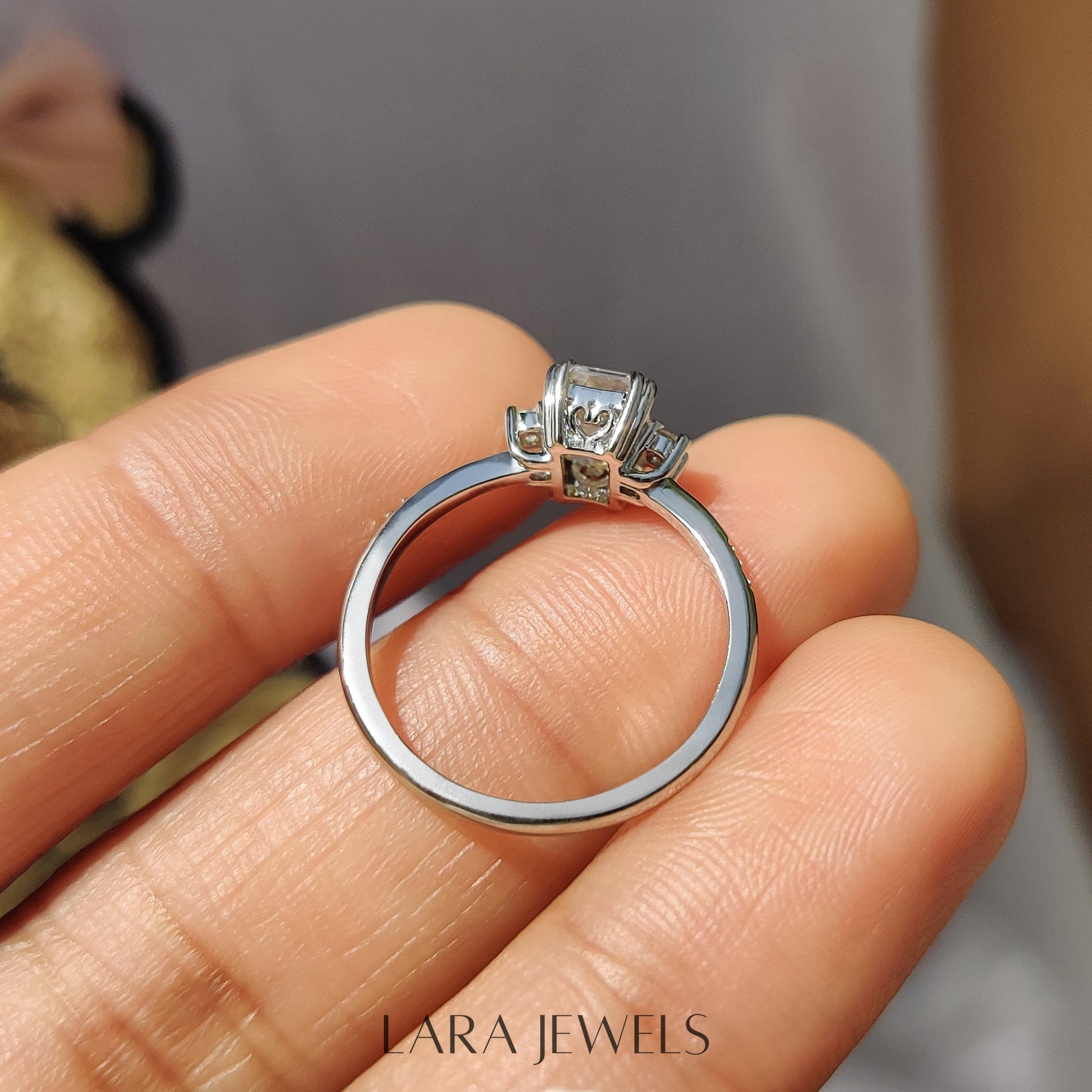 Lab grown emerald engagement ring in Lara Jewels setting, available in Silver. IGI certified, ethically sourced, handcrafted at Lara Jewels.