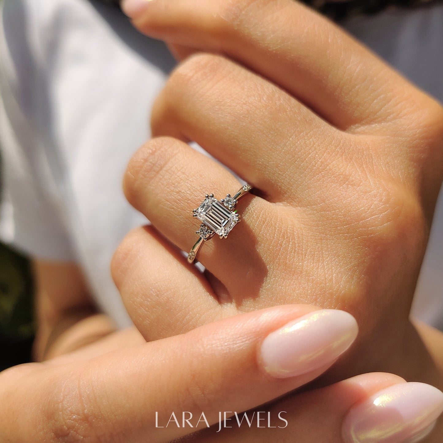 Lab grown emerald engagement ring in Lara Jewels setting, available in Silver. IGI certified, ethically sourced, handcrafted at Lara Jewels.