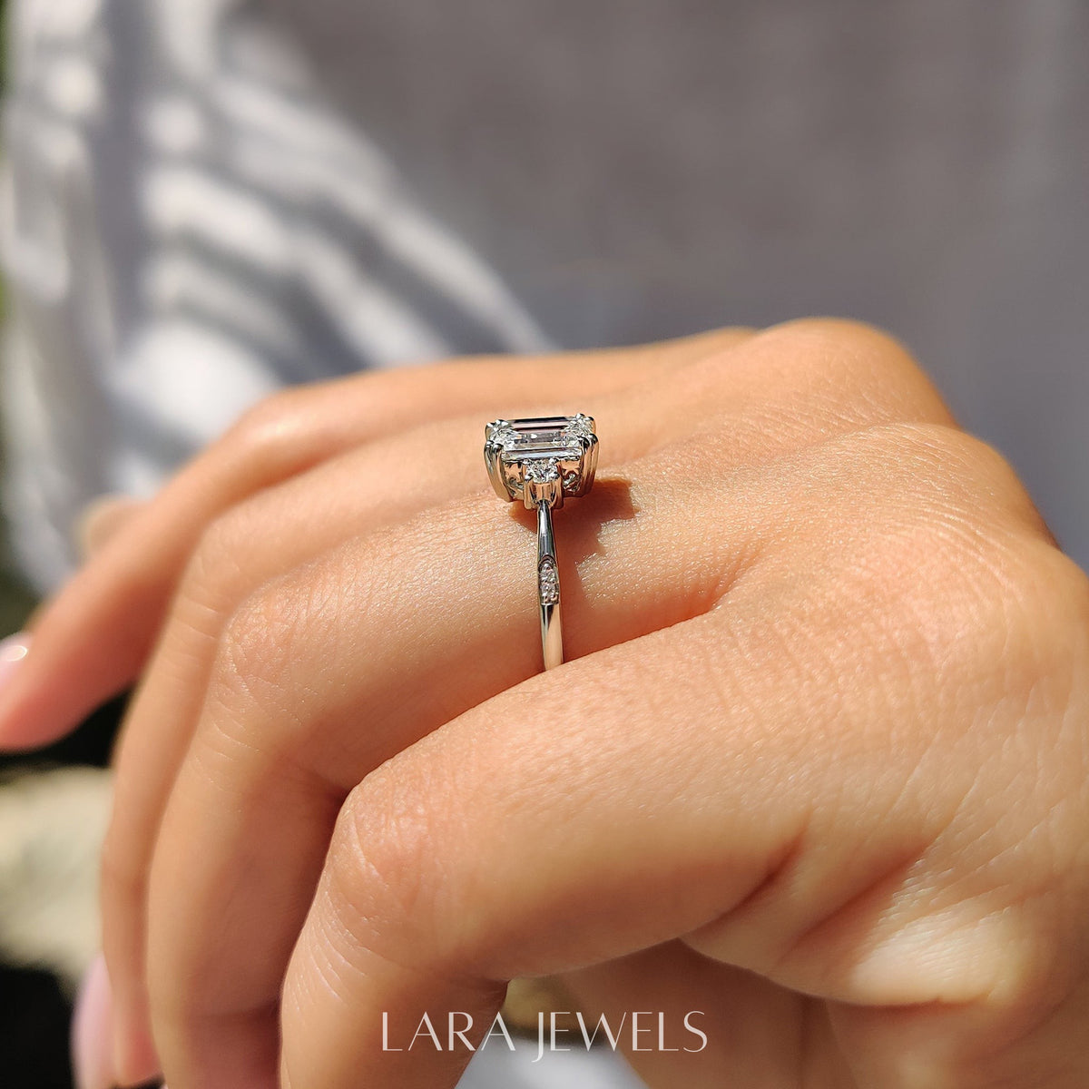Lab grown emerald engagement ring in Lara Jewels setting, available in Silver. IGI certified, ethically sourced, handcrafted at Lara Jewels.