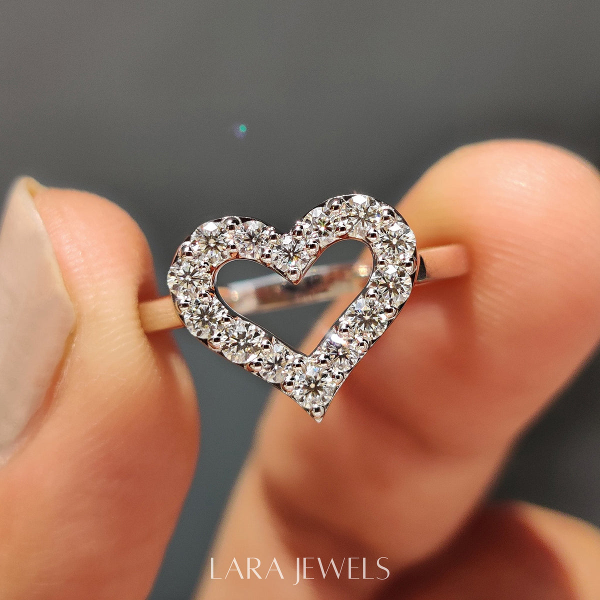 Lab grown round engagement ring in Round Cut Moissanite, available in Silver. IGI certified, ethically sourced, handcrafted at Lara Jewels.