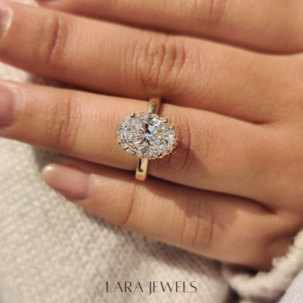 Lab grown oval engagement ring in Round Cut Diamond Basket Setting, available in Silver. IGI certified, ethically sourced, handcrafted at Lara Jewels.