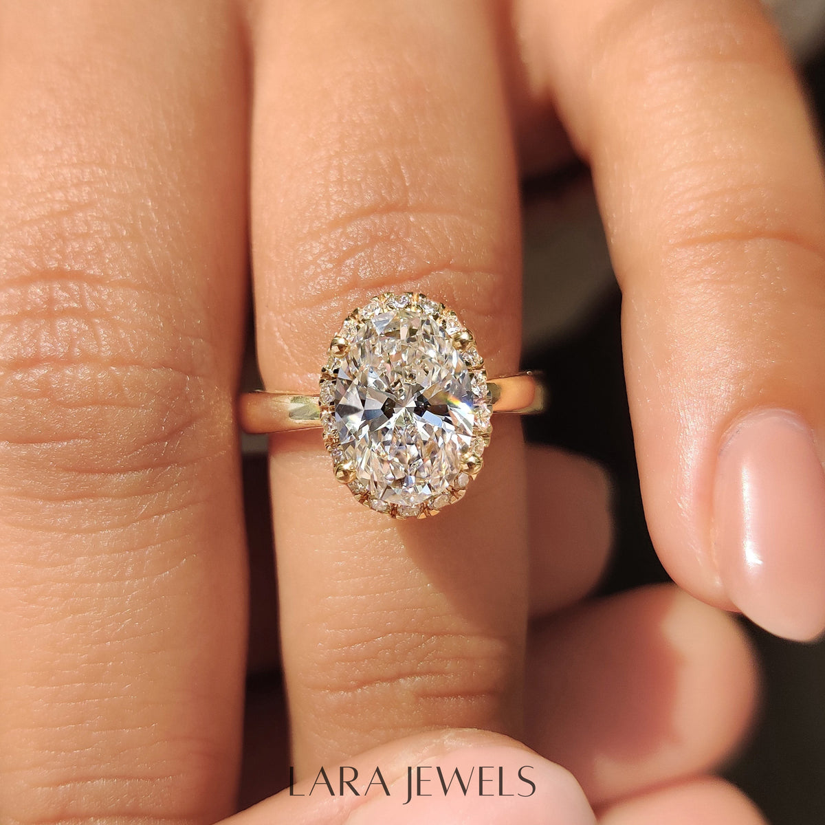 Lab grown oval engagement ring in Round Cut Diamond Basket Setting, available in Silver. IGI certified, ethically sourced, handcrafted at Lara Jewels.