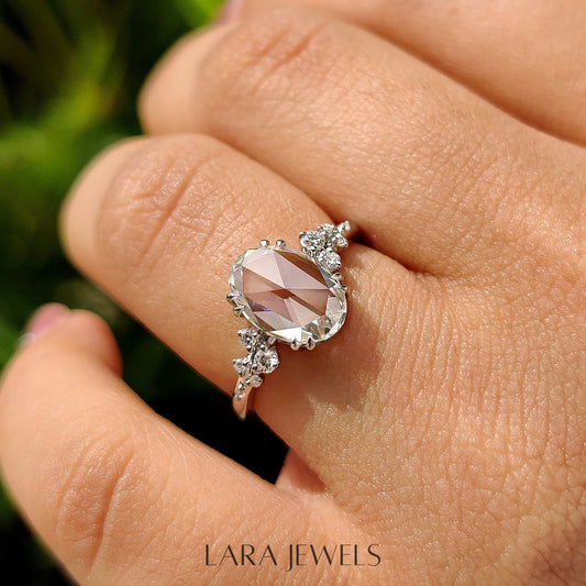 Lab grown oval engagement ring in Cluster Setting, available in Silver. IGI certified, ethically sourced, handcrafted at Lara Jewels.