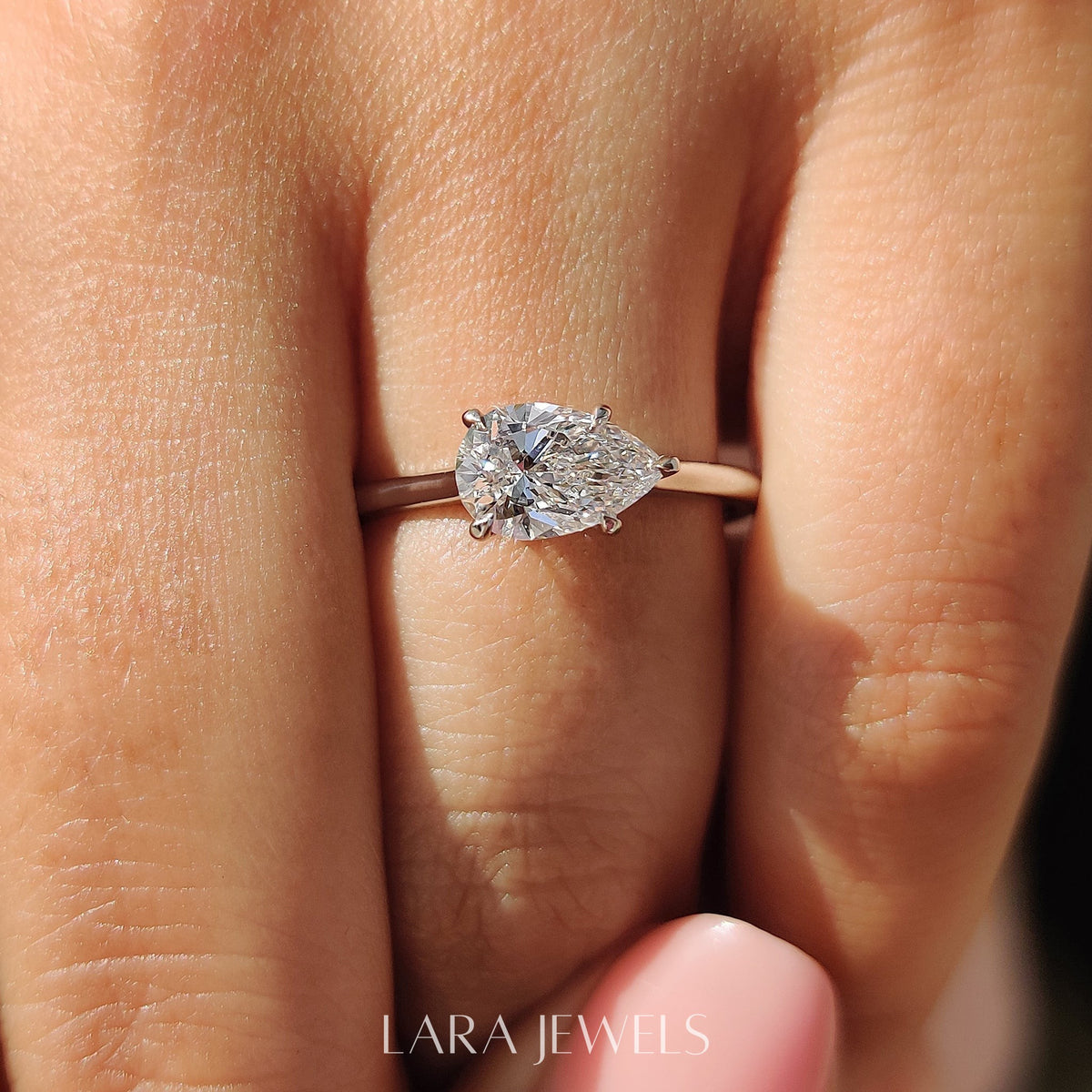 Lab grown pear engagement ring in Lara Jewels setting, available in Silver. IGI certified, ethically sourced, handcrafted at Lara Jewels.