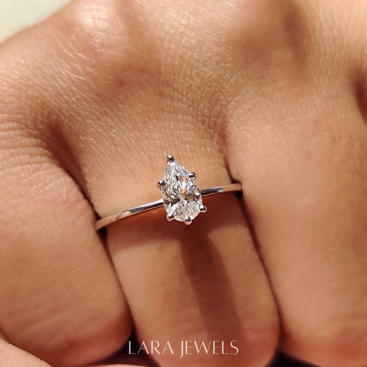 Lab grown pear engagement ring in Lara Jewels setting, available in Silver. IGI certified, ethically sourced, handcrafted at Lara Jewels.