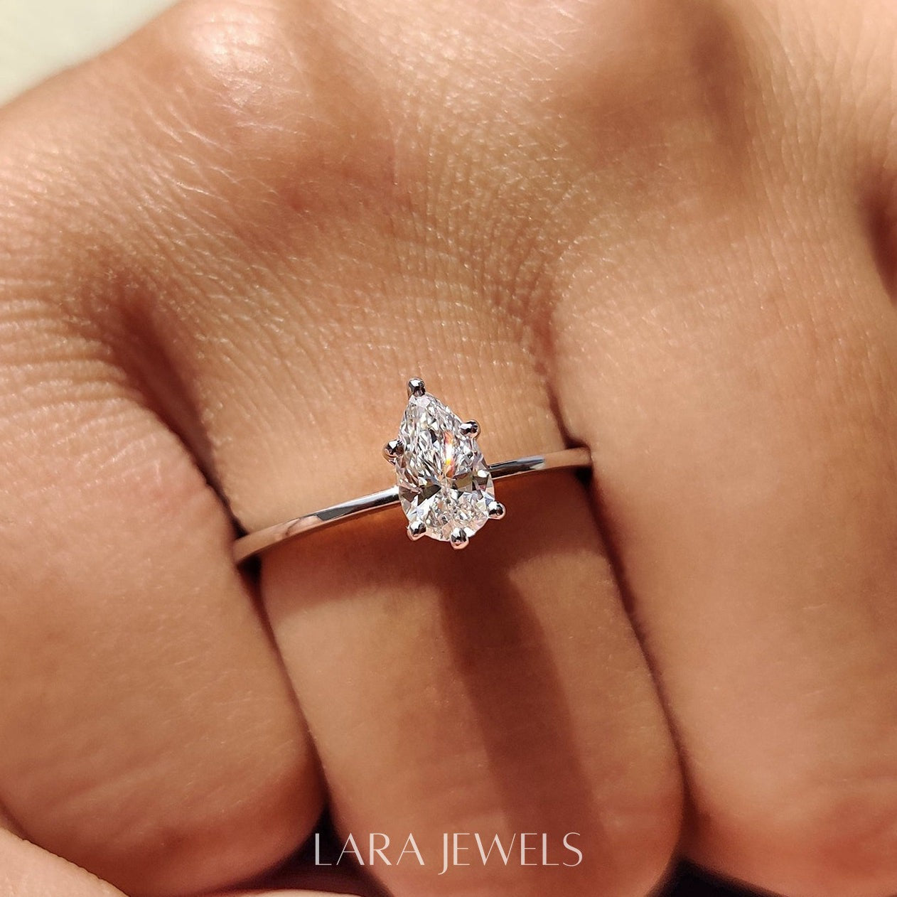 Lab grown pear engagement ring in Lara Jewels setting, available in Silver. IGI certified, ethically sourced, handcrafted at Lara Jewels.