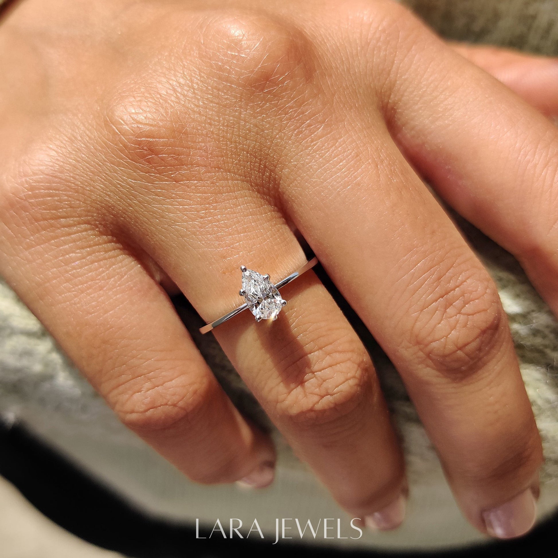 Lab grown pear engagement ring in Lara Jewels setting, available in Silver. IGI certified, ethically sourced, handcrafted at Lara Jewels.