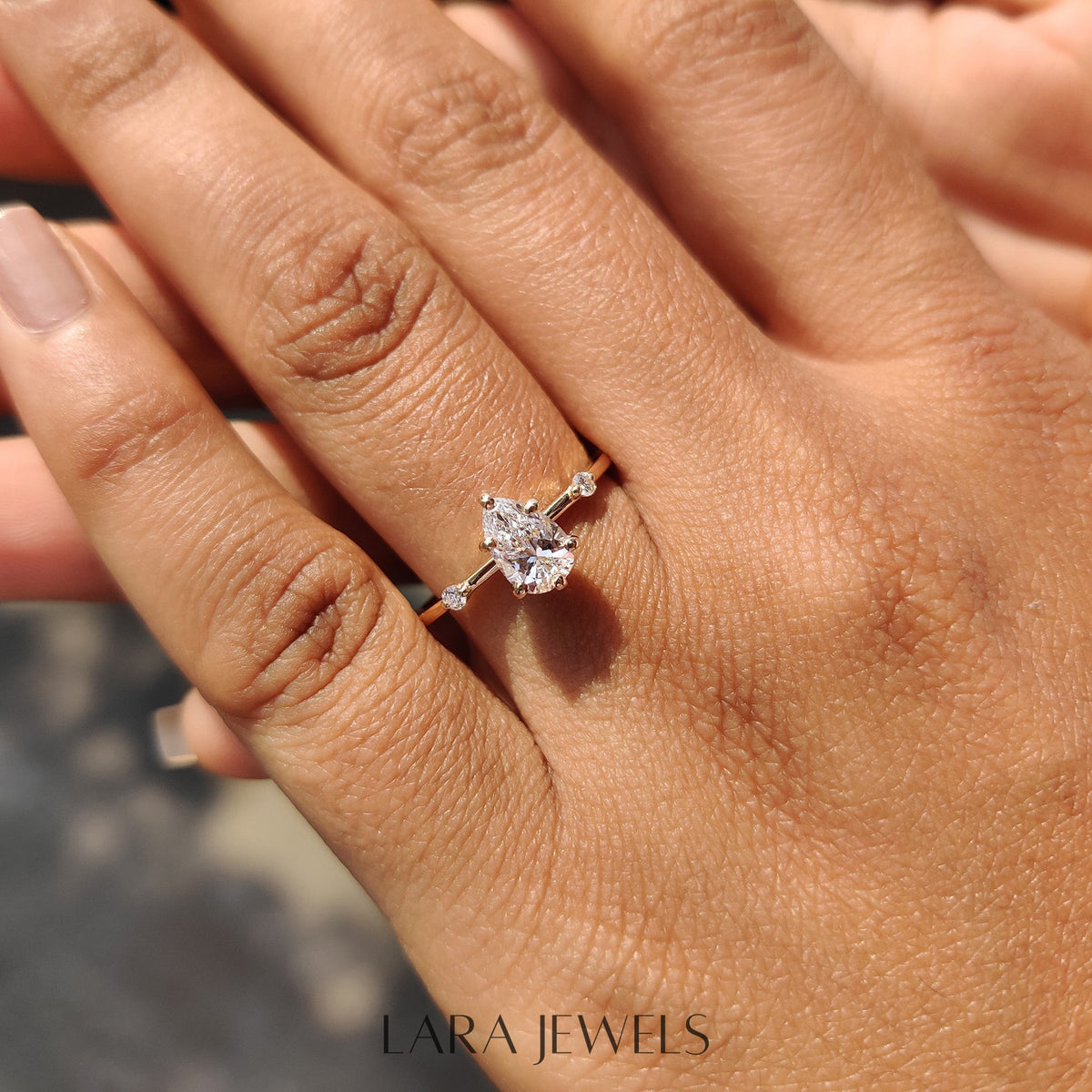 Lab grown pear engagement ring in Lara Jewels setting, available in Silver. IGI certified, ethically sourced, handcrafted at Lara Jewels.