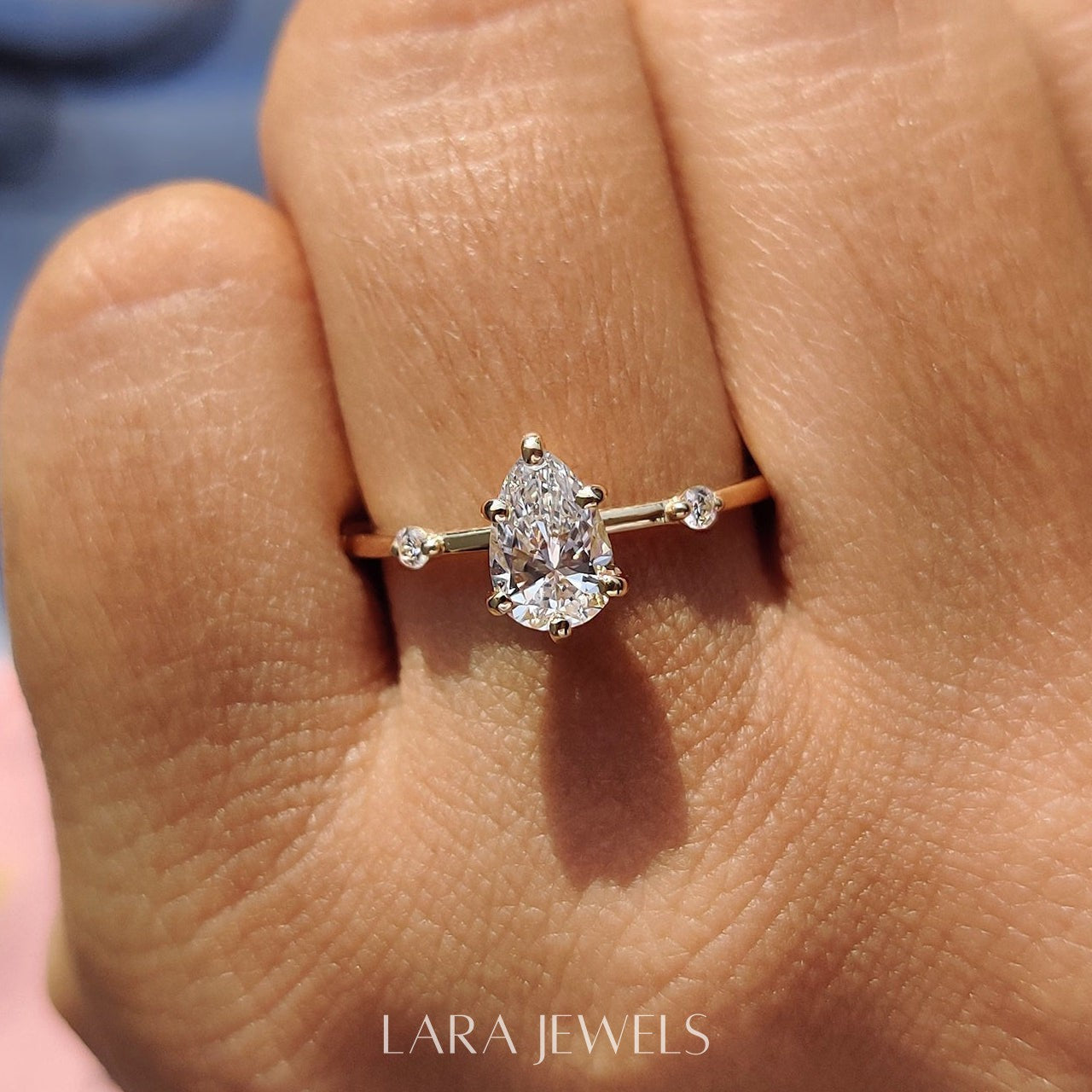 Lab grown pear engagement ring in Lara Jewels setting, available in Silver. IGI certified, ethically sourced, handcrafted at Lara Jewels.