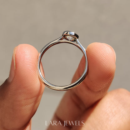 Lab grown round engagement ring in Bezel Solitaire Setting, available in Silver. IGI certified, ethically sourced, handcrafted at Lara Jewels.