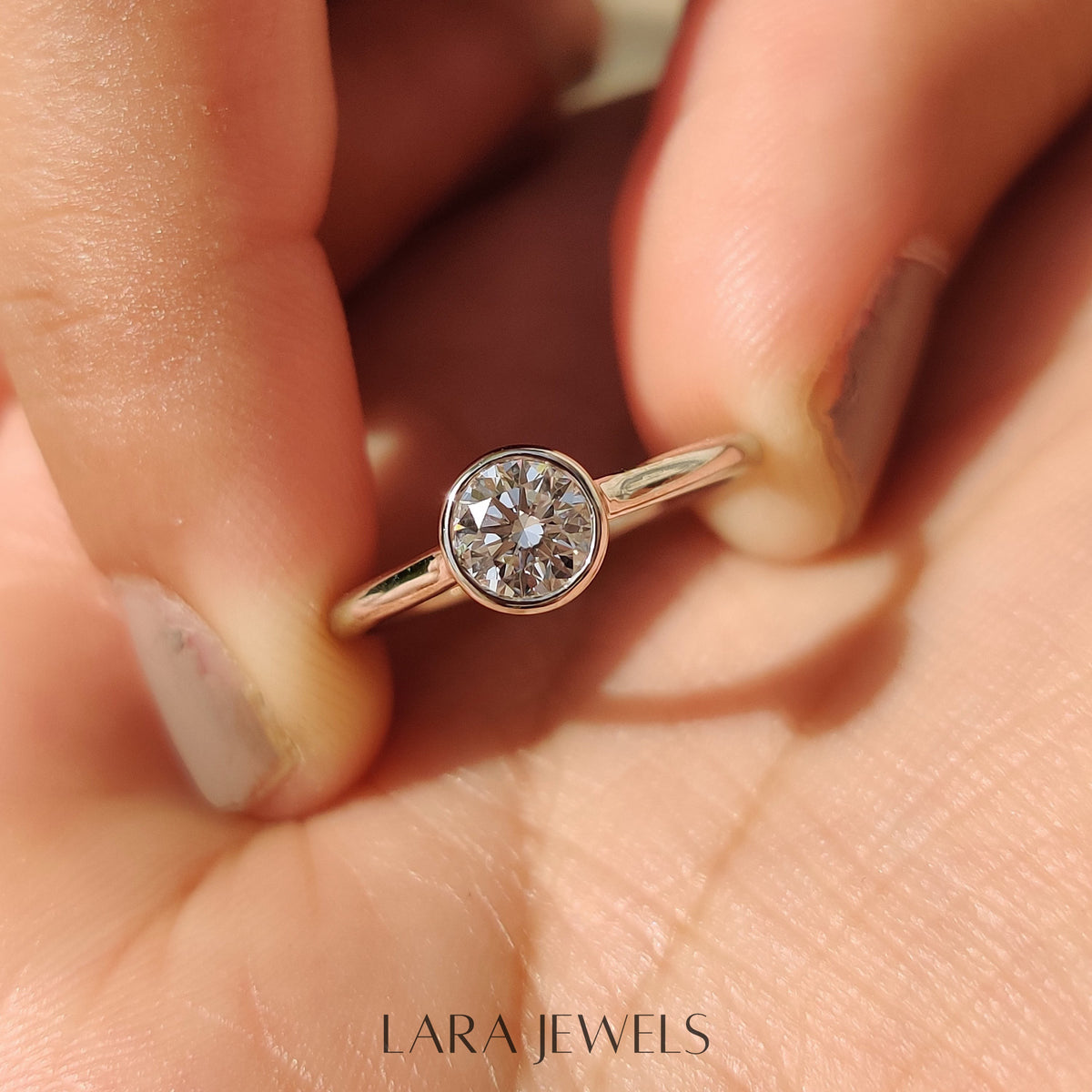 Lab grown round engagement ring in Bezel Solitaire Setting, available in Silver. IGI certified, ethically sourced, handcrafted at Lara Jewels.