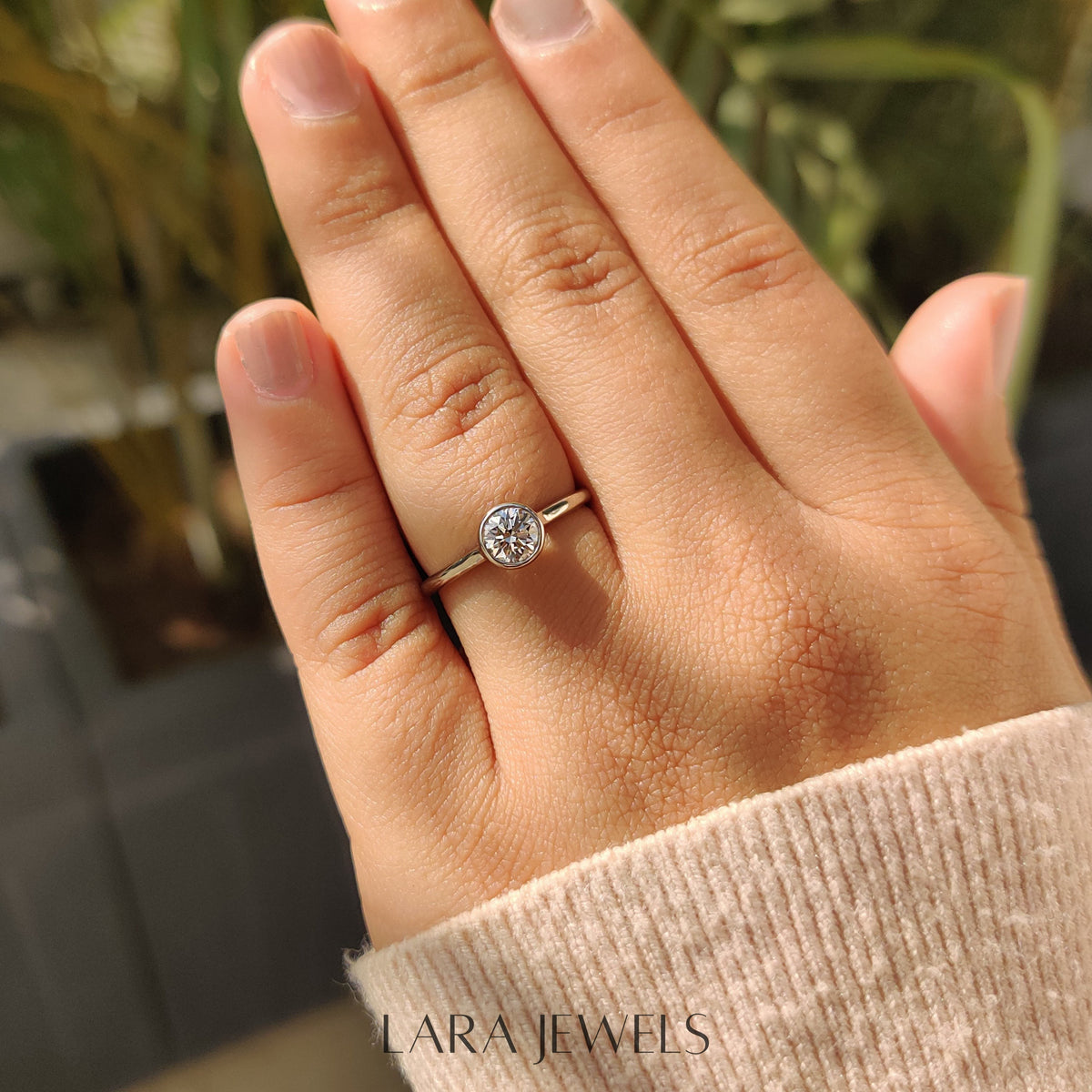 Lab grown round engagement ring in Bezel Solitaire Setting, available in Silver. IGI certified, ethically sourced, handcrafted at Lara Jewels.