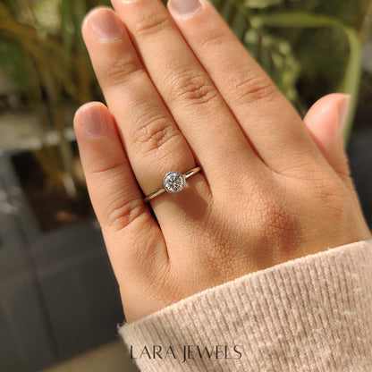 Lab grown round engagement ring in Bezel Solitaire Setting, available in Silver. IGI certified, ethically sourced, handcrafted at Lara Jewels.