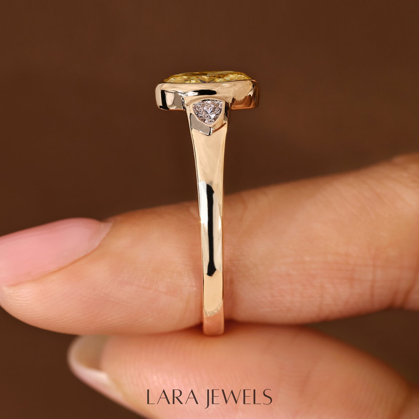 Lab grown oval engagement ring in Trillion Side Stone, available in Silver. IGI certified, ethically sourced, handcrafted at Lara Jewels.