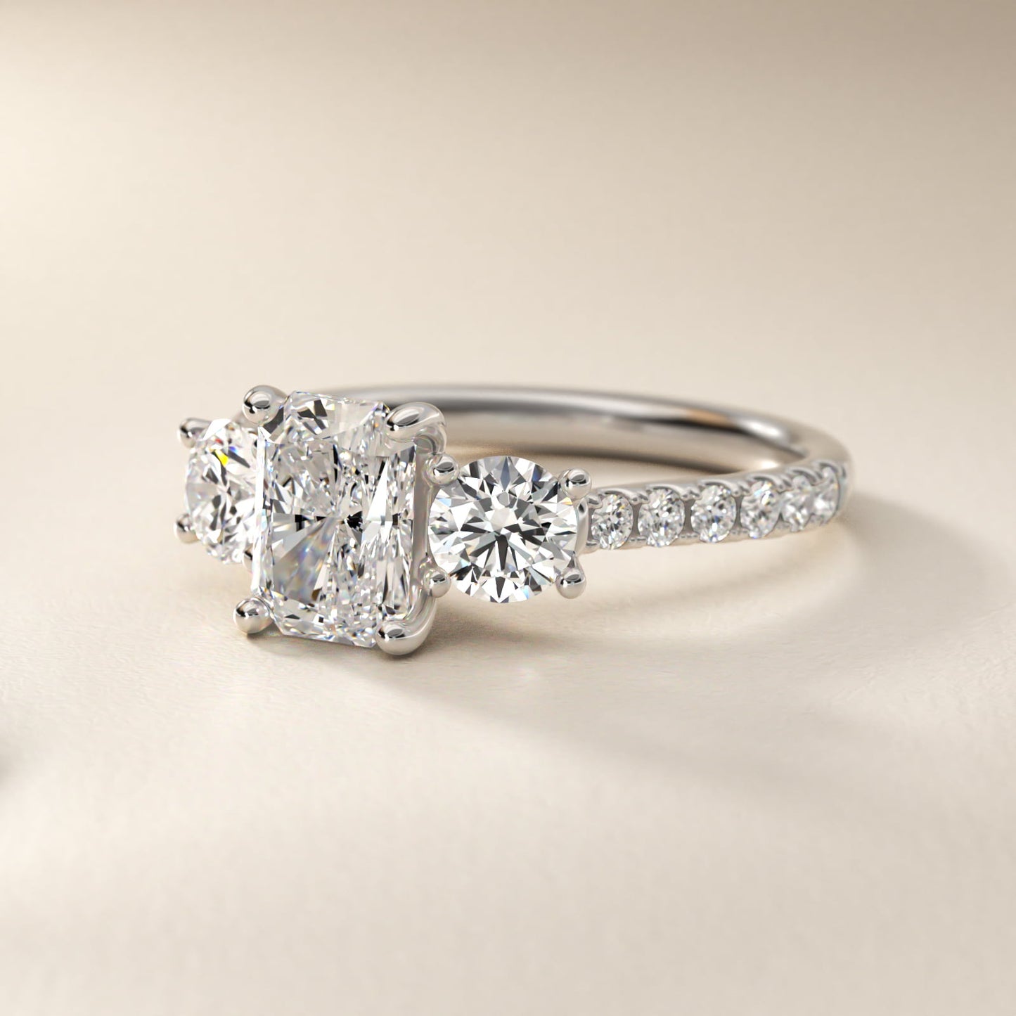 Modern Trellis Three Stone Diamond Engagement in Platinum - Radiant Center