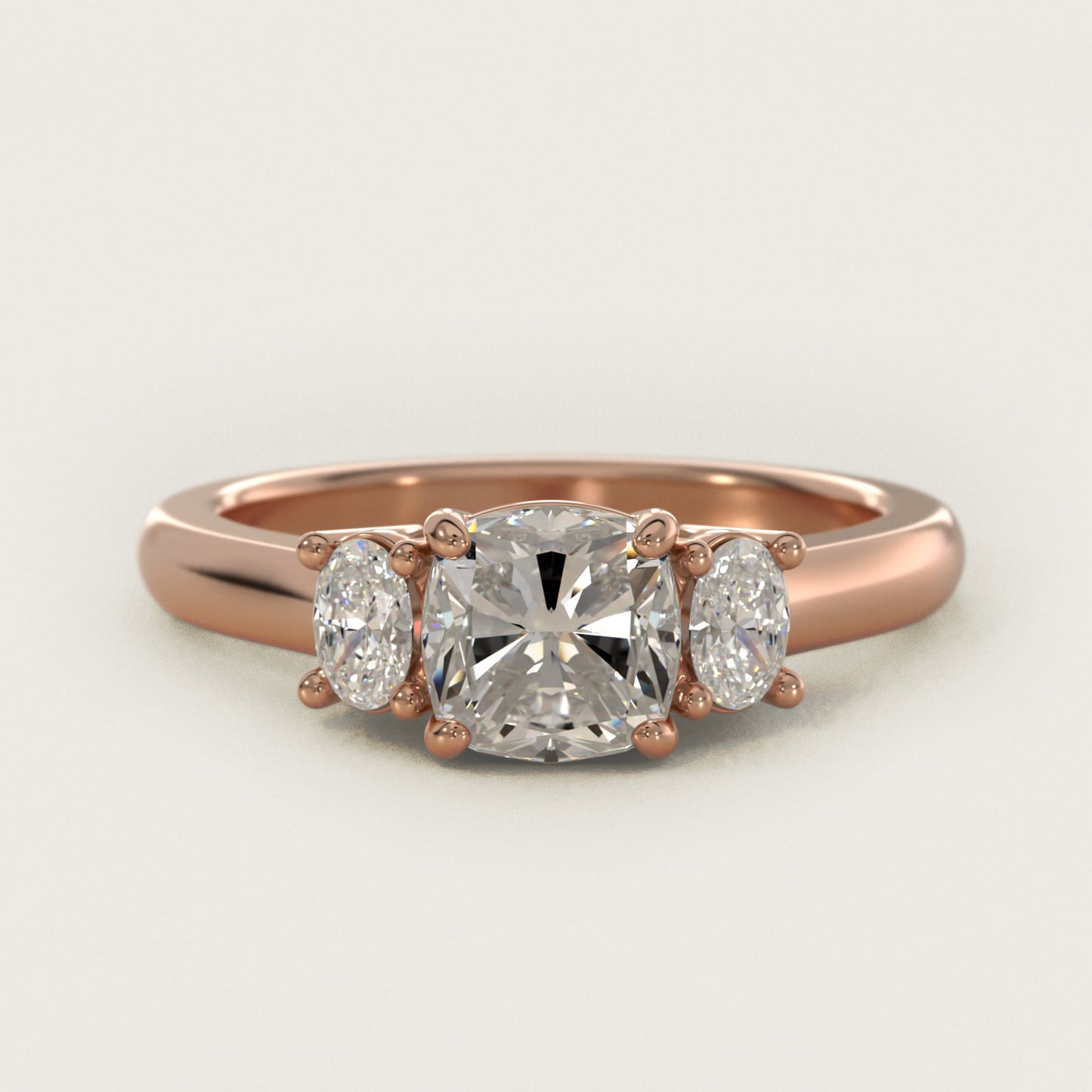 Oval Three-Stone Diamond Engagement Ring in 14k Rose Gold (1/3 ct. tw.) - Cushion Center