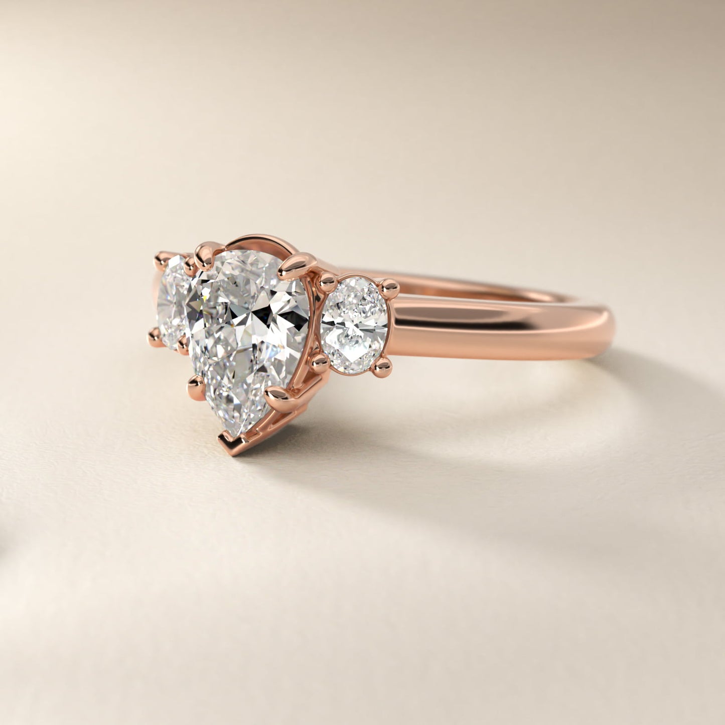 Oval Three-Stone Diamond Engagement Ring in 18k Rose Gold (1/3 ct. tw.) - Pear Center