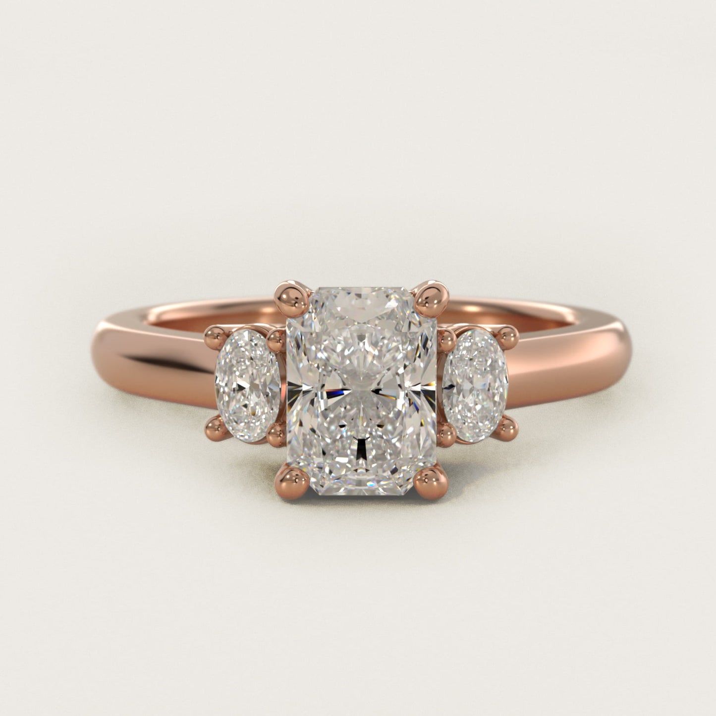 Oval Three-Stone Diamond Engagement Ring in 14k Rose Gold (1/3 ct. tw.) - Radiant Center