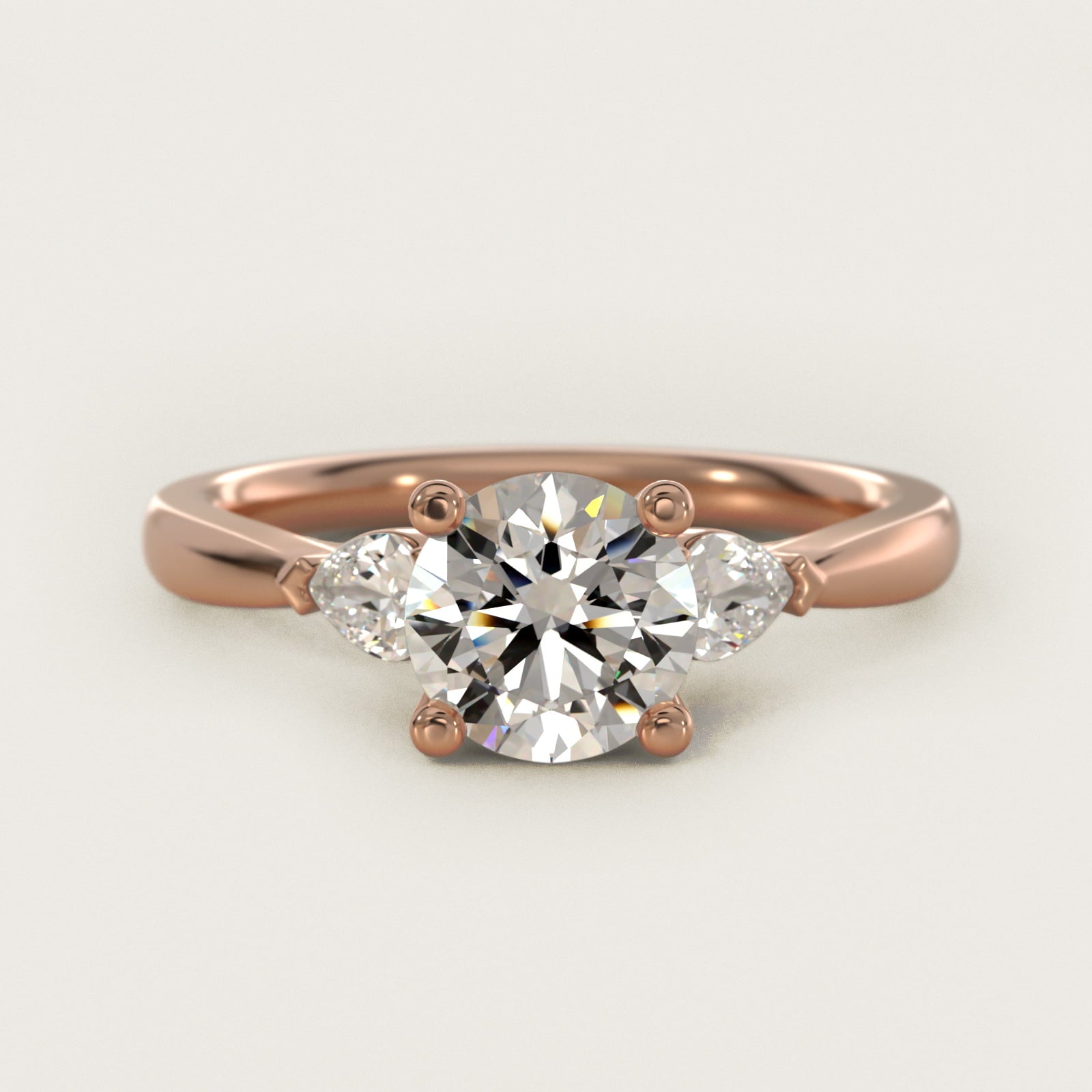 Pear Sidestone Diamond Engagement Ring in 14k Rose Gold (1/4 ct. tw.) - Round Center