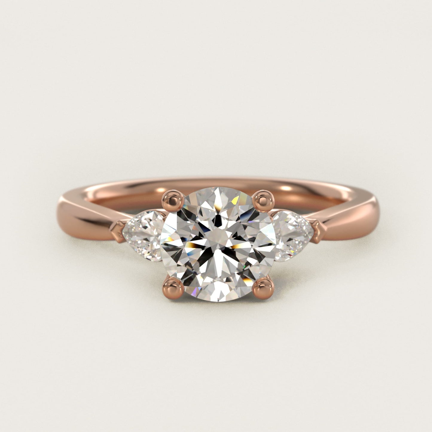 Pear Sidestone Diamond Engagement Ring in 18k Rose Gold (1/4 ct. tw.) - Round Center